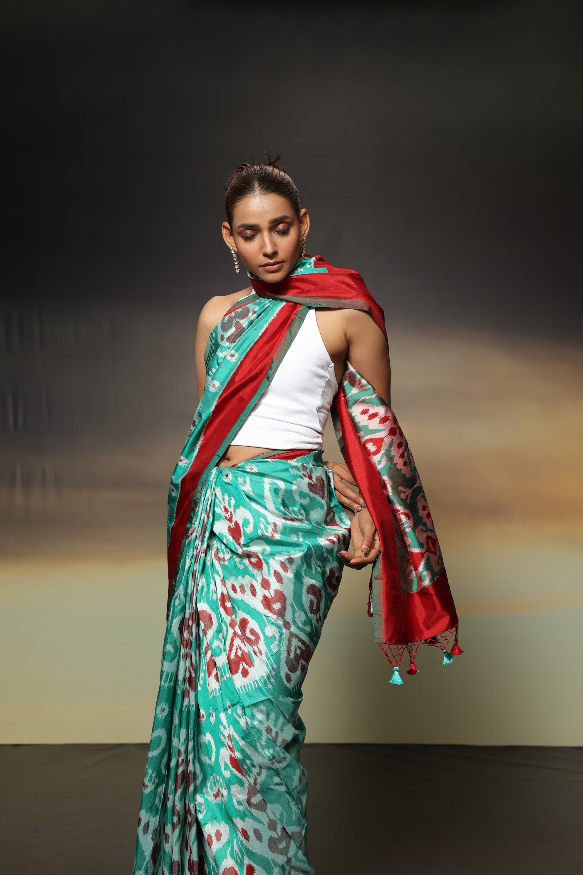 MAGIZHAM- Exclusive Uzbek silk ikkat in seafoam green hue with radiant red undertones, recreated from museum treasured archive pieces