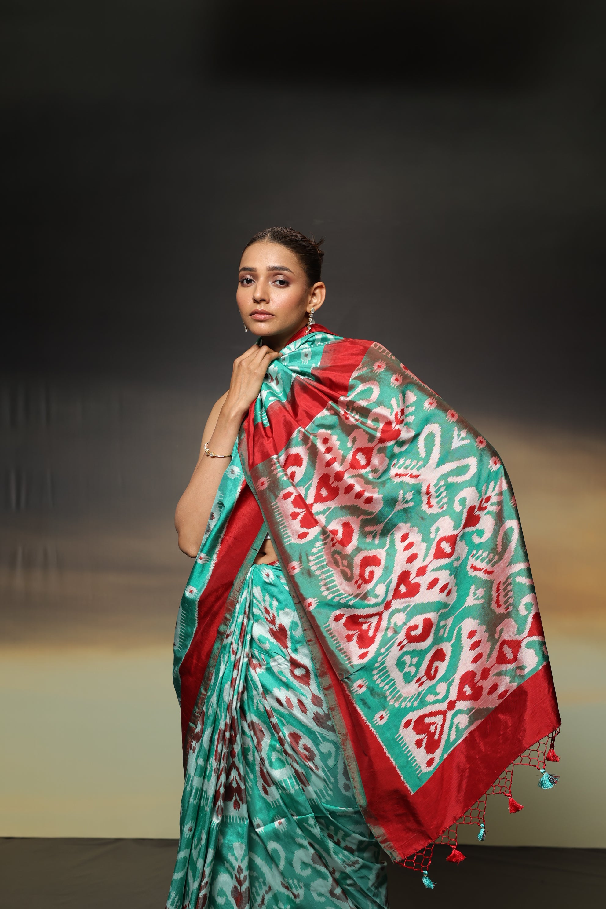 MAGIZHAM- Exclusive Uzbek silk ikkat in seafoam green hue with radiant red undertones, recreated from museum treasured archive pieces