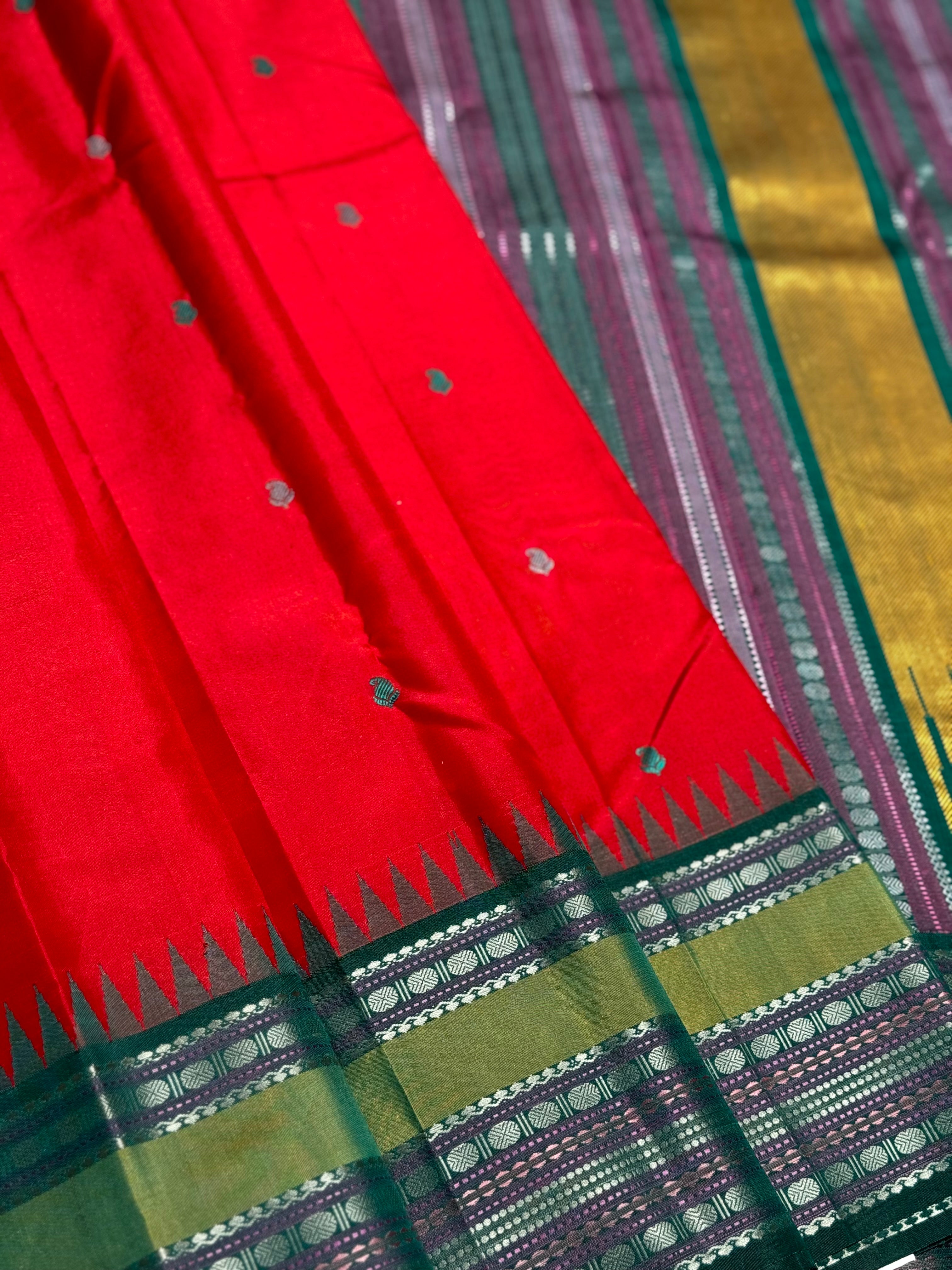 The stunner tomato red with green shade korvai kanchivaram silk saree with thread work korvai