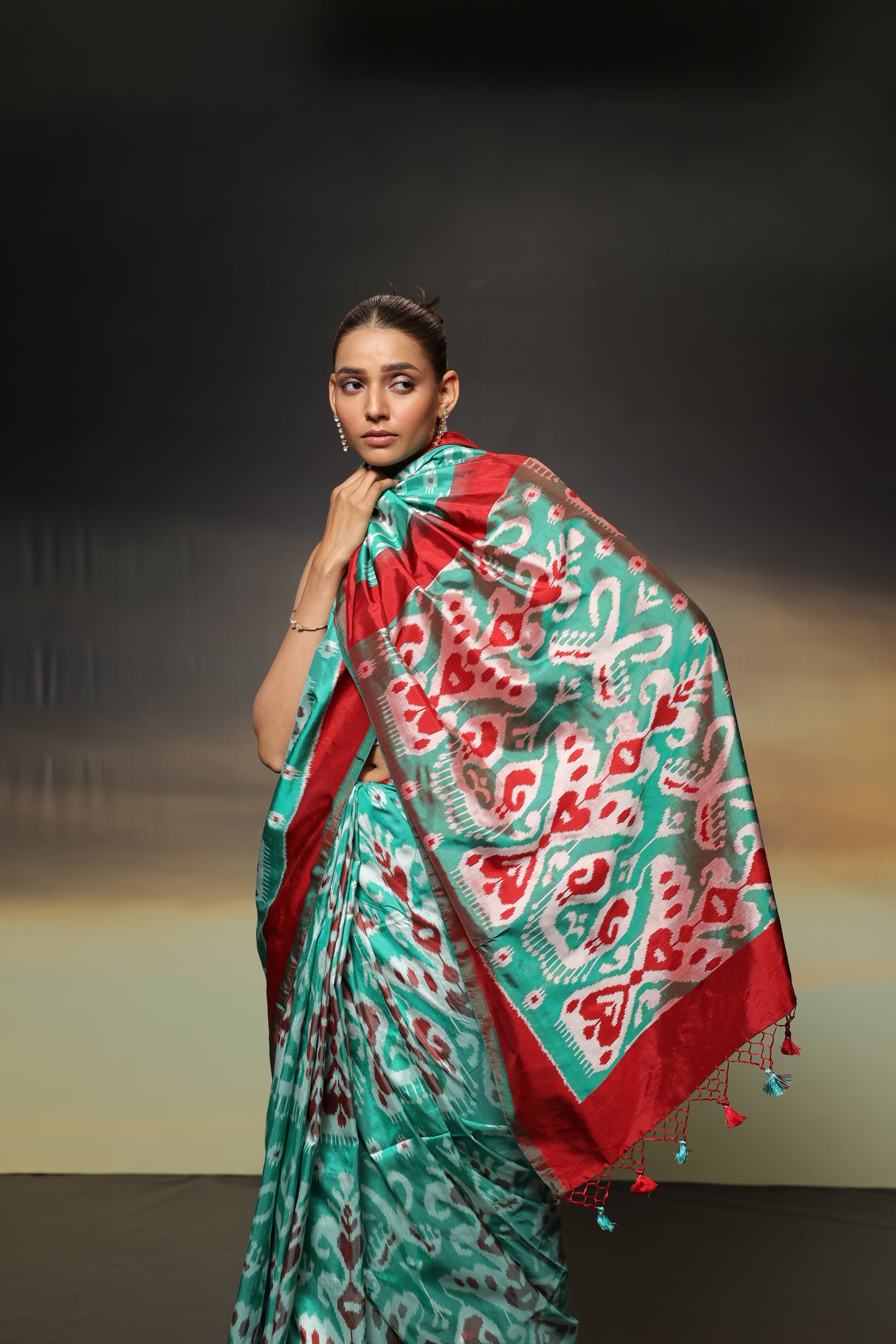 MAGIZHAM- Exclusive Uzbek silk ikkat in seafoam green hue with radiant red undertones, recreated from museum treasured archive pieces