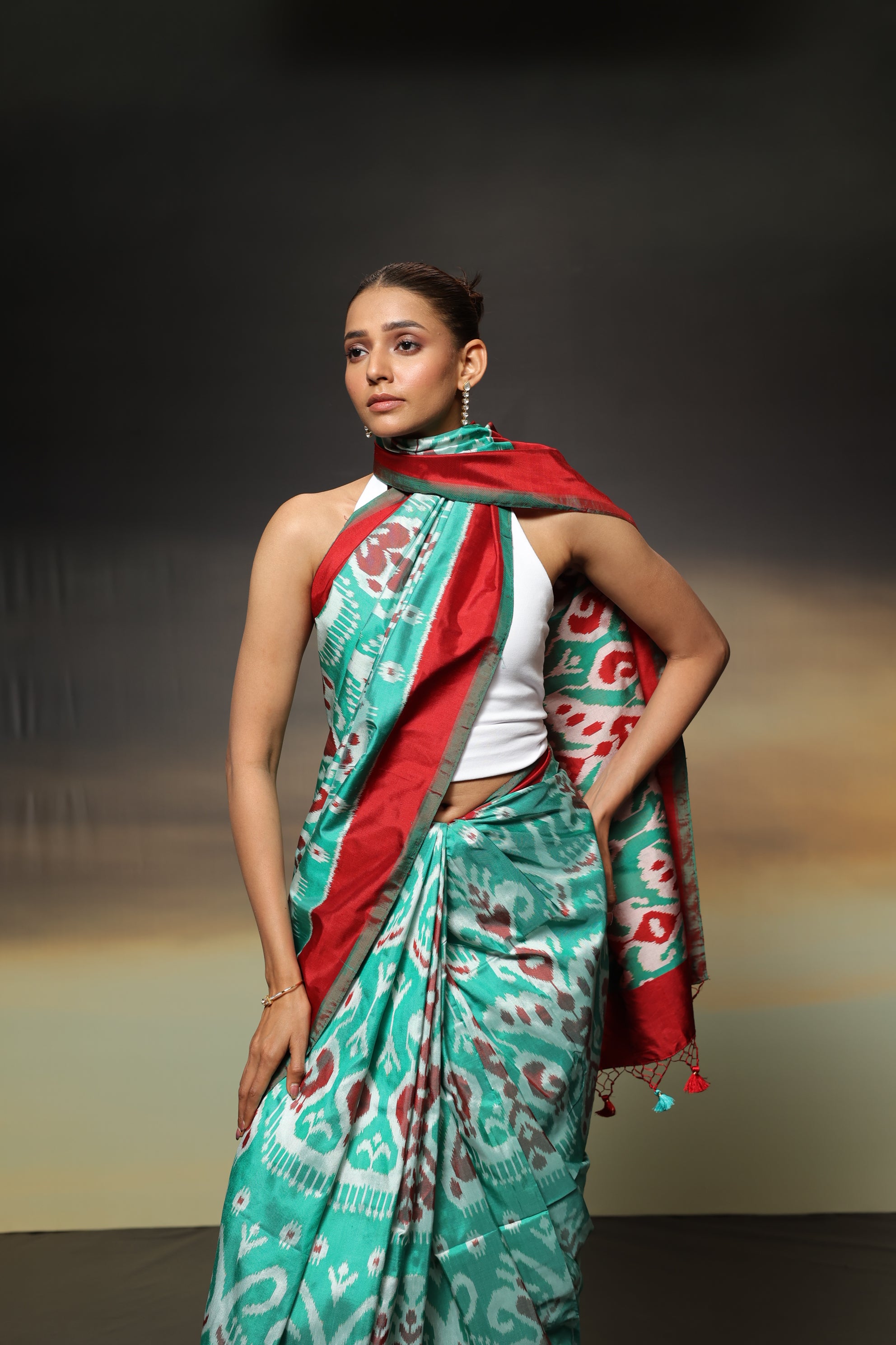 MAGIZHAM- Exclusive Uzbek silk ikkat in seafoam green hue with radiant red undertones, recreated from museum treasured archive pieces