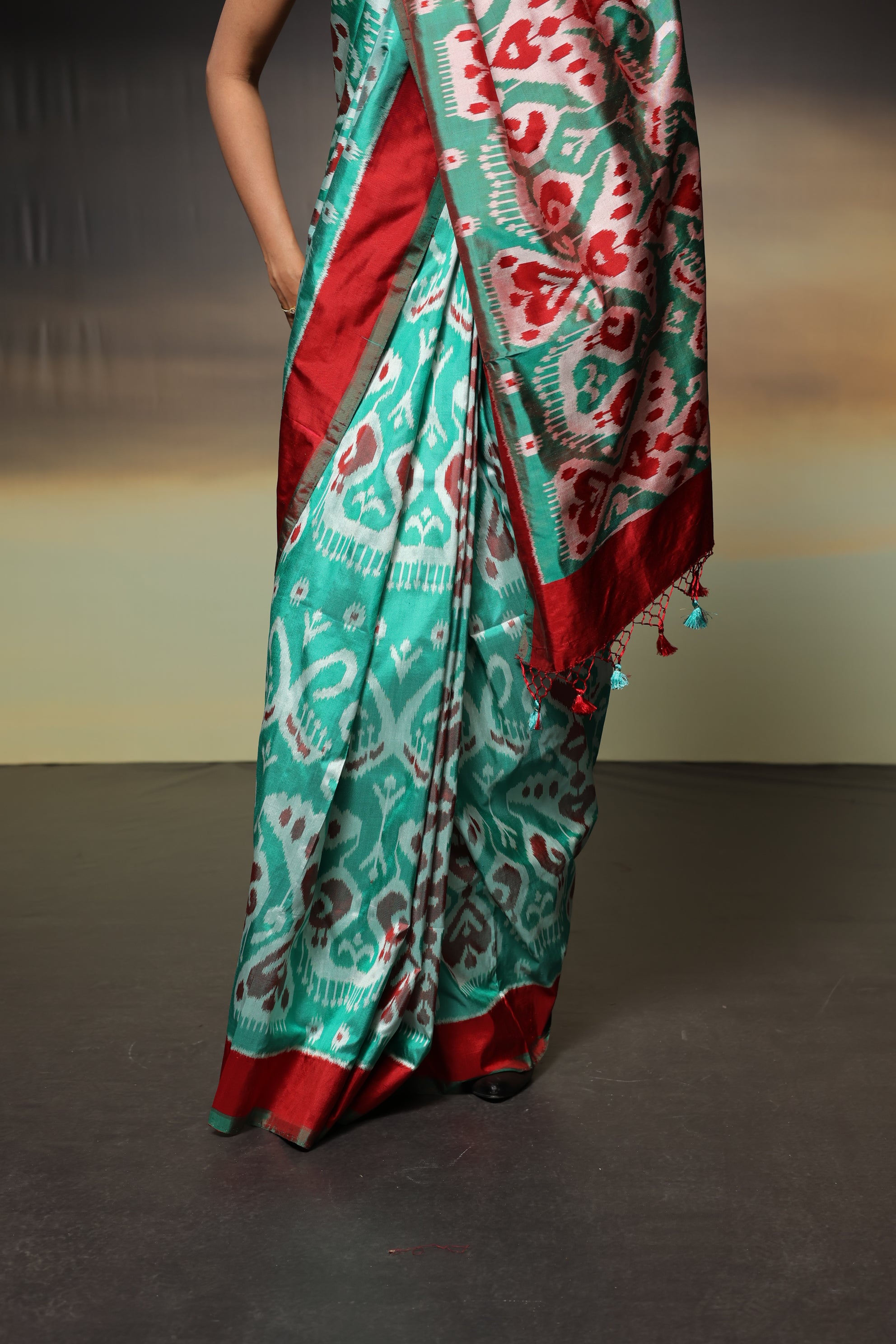 MAGIZHAM- Exclusive Uzbek silk ikkat in seafoam green hue with radiant red undertones, recreated from museum treasured archive pieces