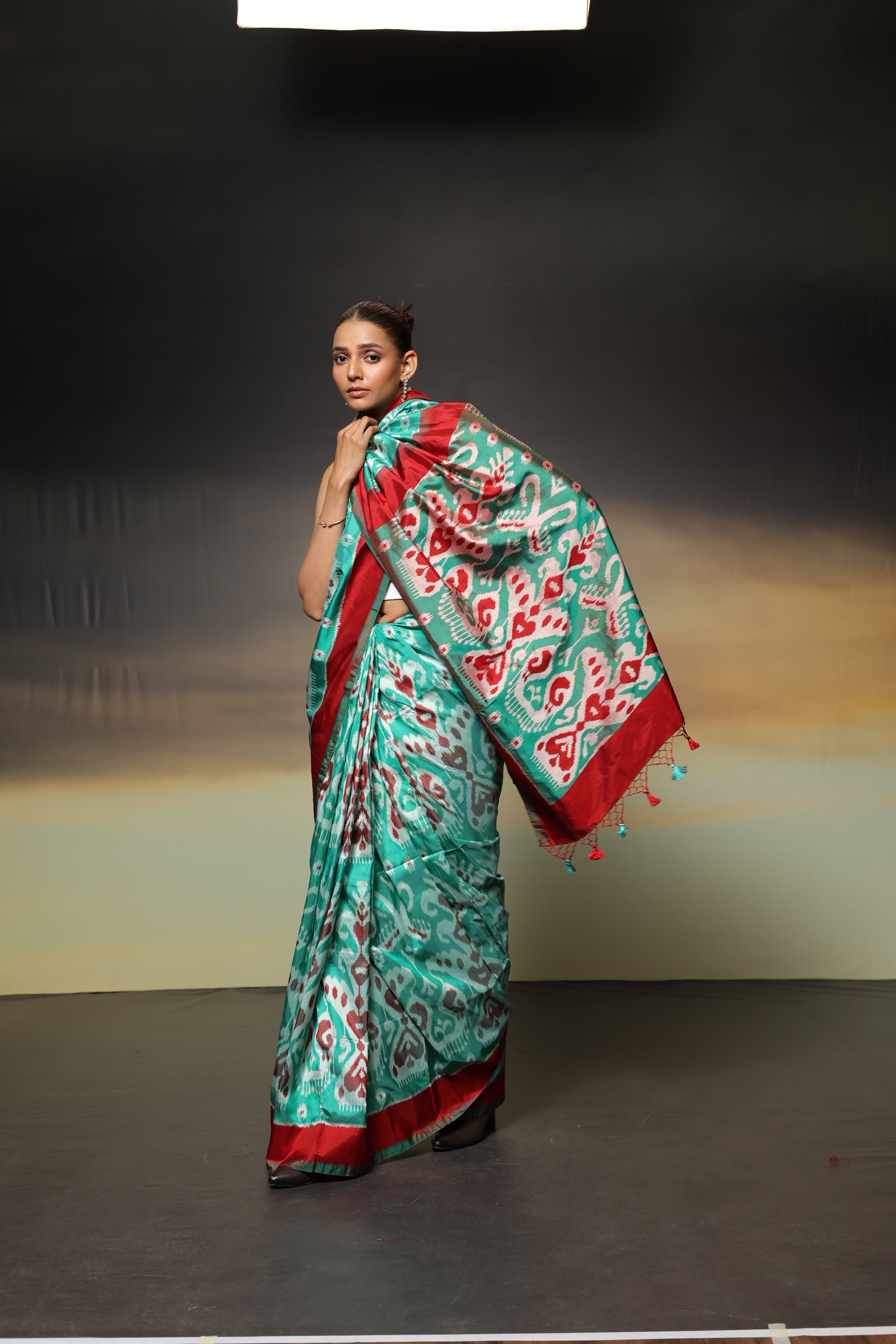 MAGIZHAM- Exclusive Uzbek silk ikkat in seafoam green hue with radiant red undertones, recreated from museum treasured archive pieces