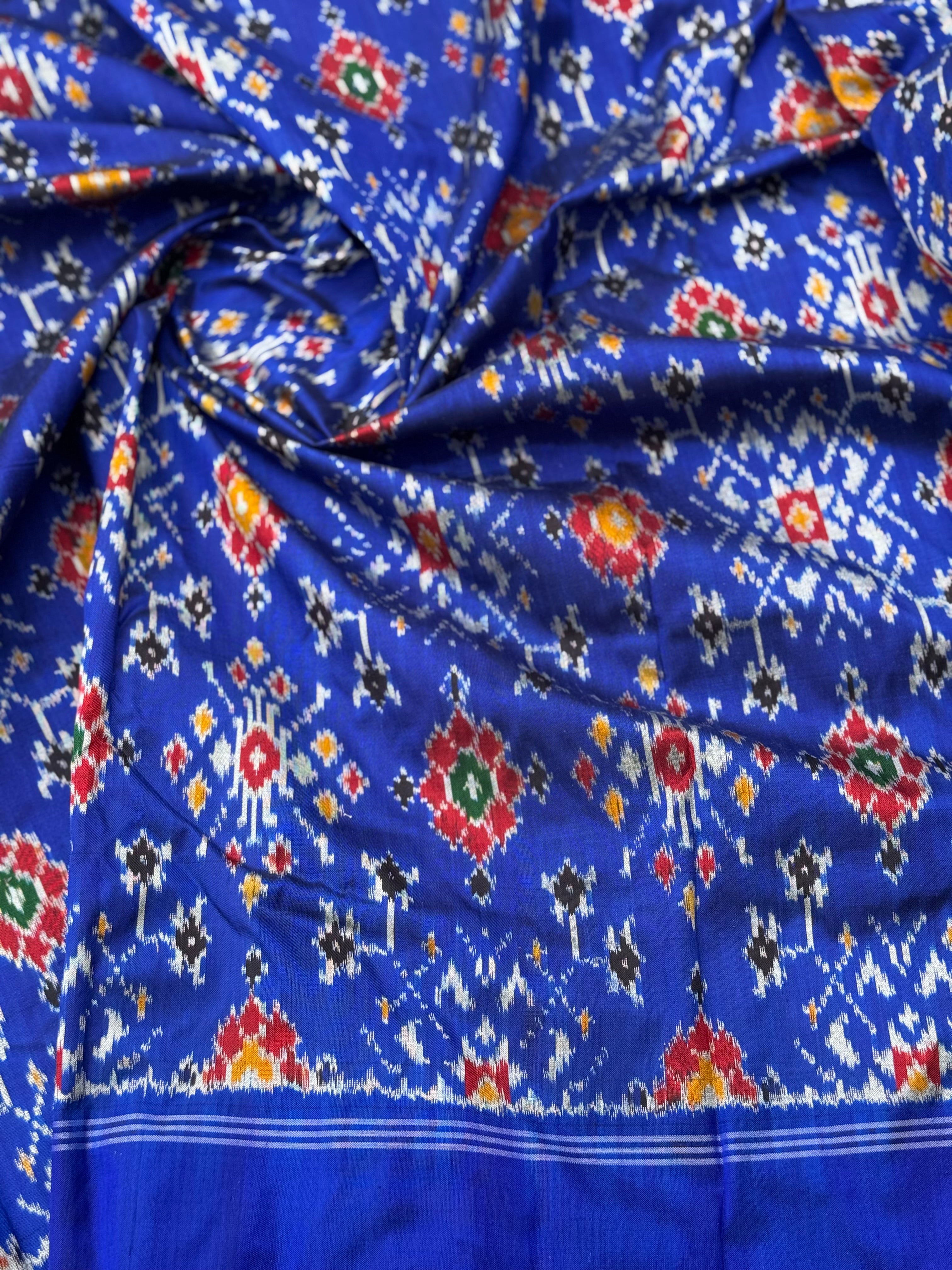 Blue patola inspired navratan ikkat design on pure mulberry silk fabric