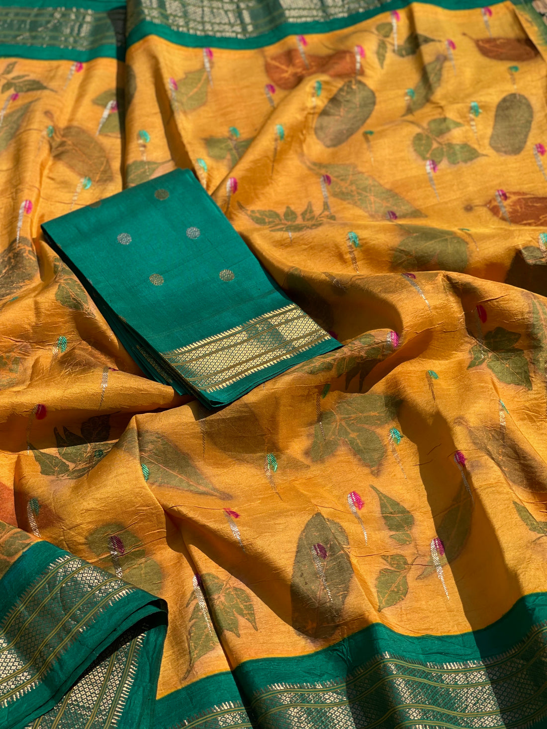 A Natural Ecoprints on Kesar Orange with seagreen Muniya Paithani silk saree