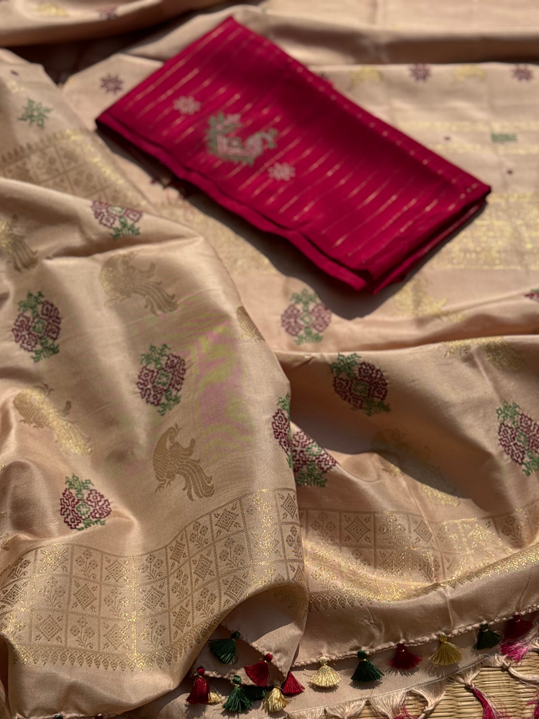 A designer exclusive almond shaded borderless kanchivaram silk saree With hand embroidered kasuti work