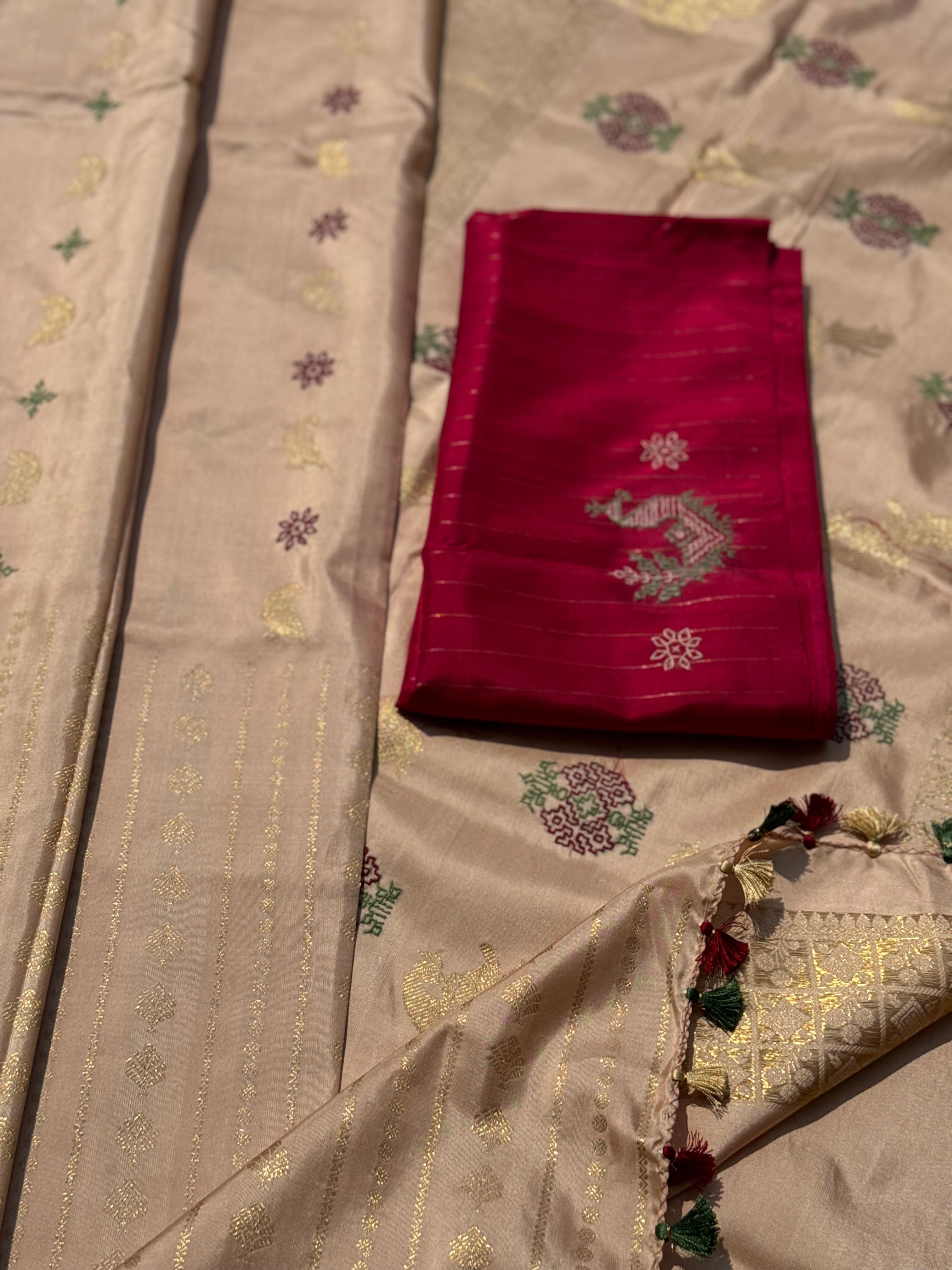 A designer exclusive almond shaded borderless kanchivaram silk saree With hand embroidered kasuti work