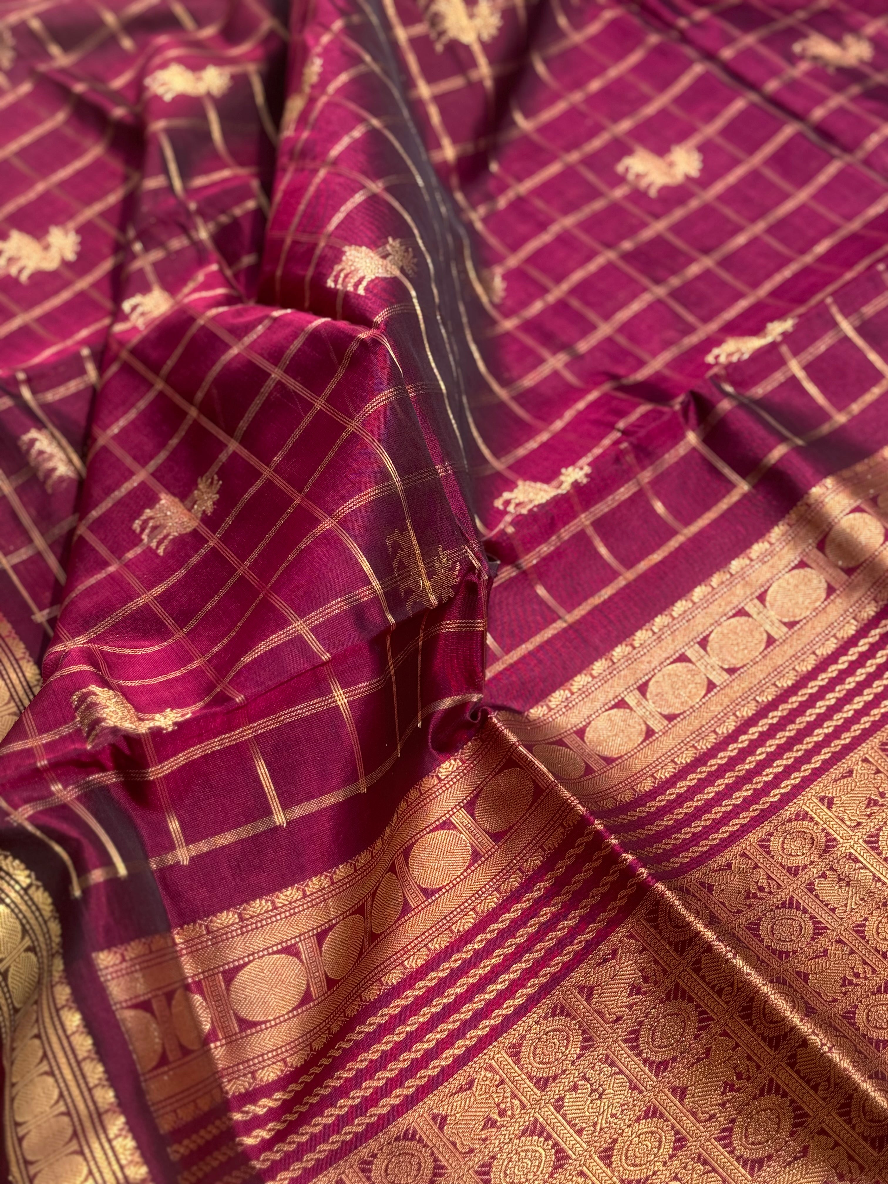 A gorgeous burgundy shade handwoven zari checks with deer motifs Kanchi silk cotton saree