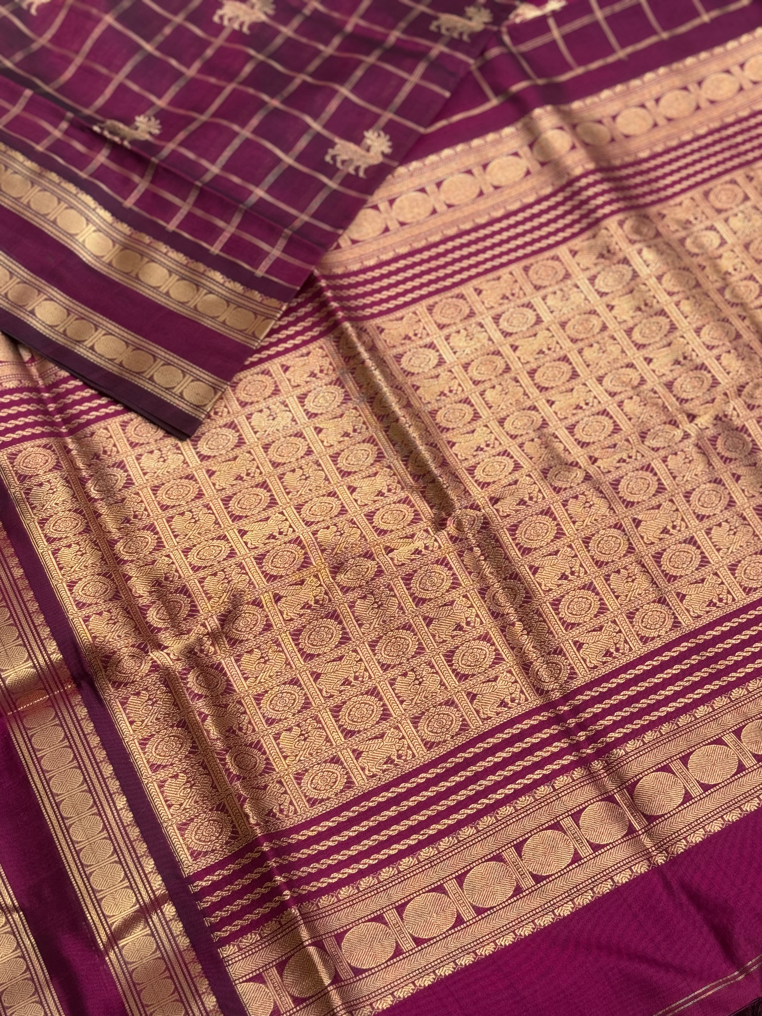 A gorgeous burgundy shade handwoven zari checks with deer motifs Kanchi silk cotton saree