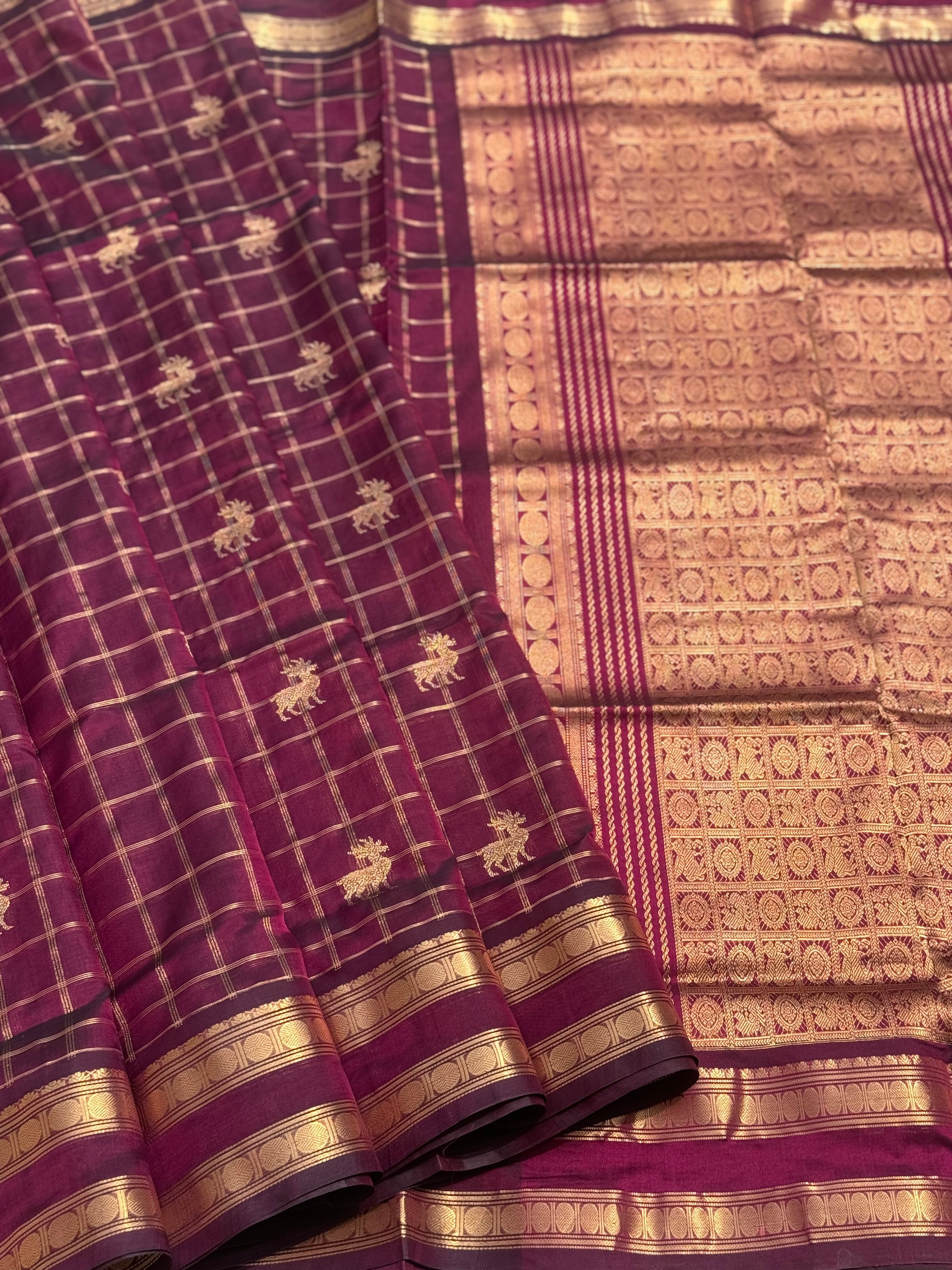A gorgeous burgundy shade handwoven zari checks with deer motifs Kanchi silk cotton saree