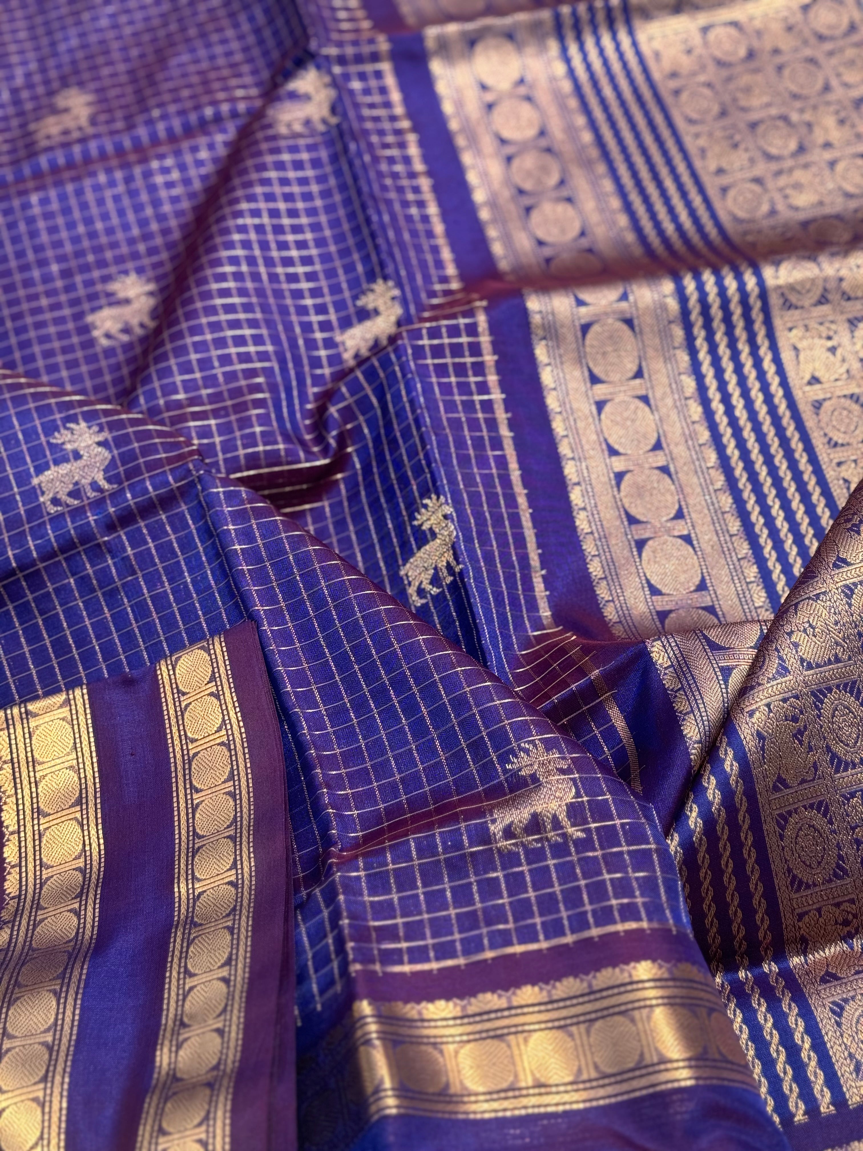 A gorgeous blue shade handwoven zari checks with deer motifs Kanchi silk cotton saree
