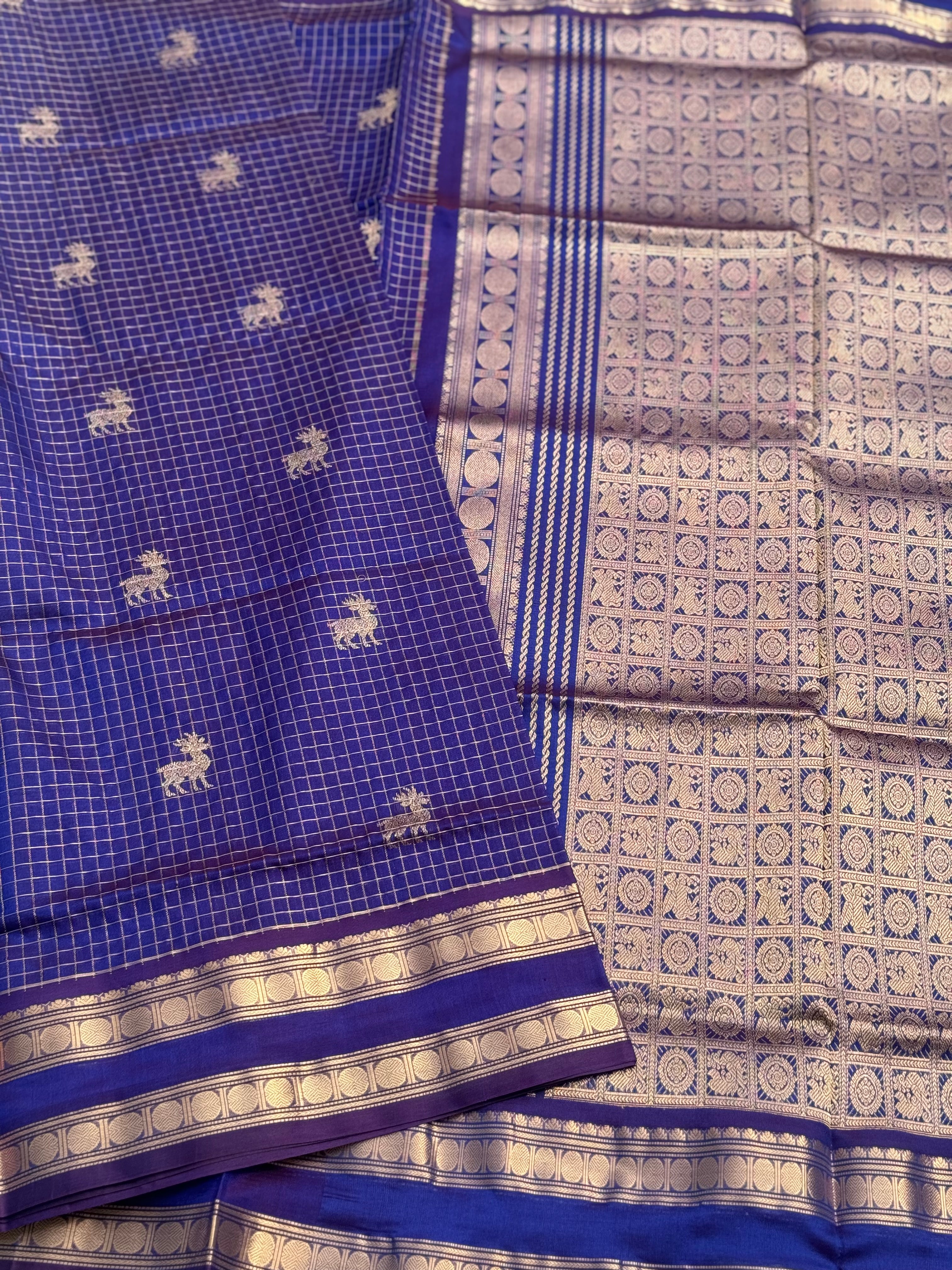A gorgeous blue shade handwoven zari checks with deer motifs Kanchi silk cotton saree