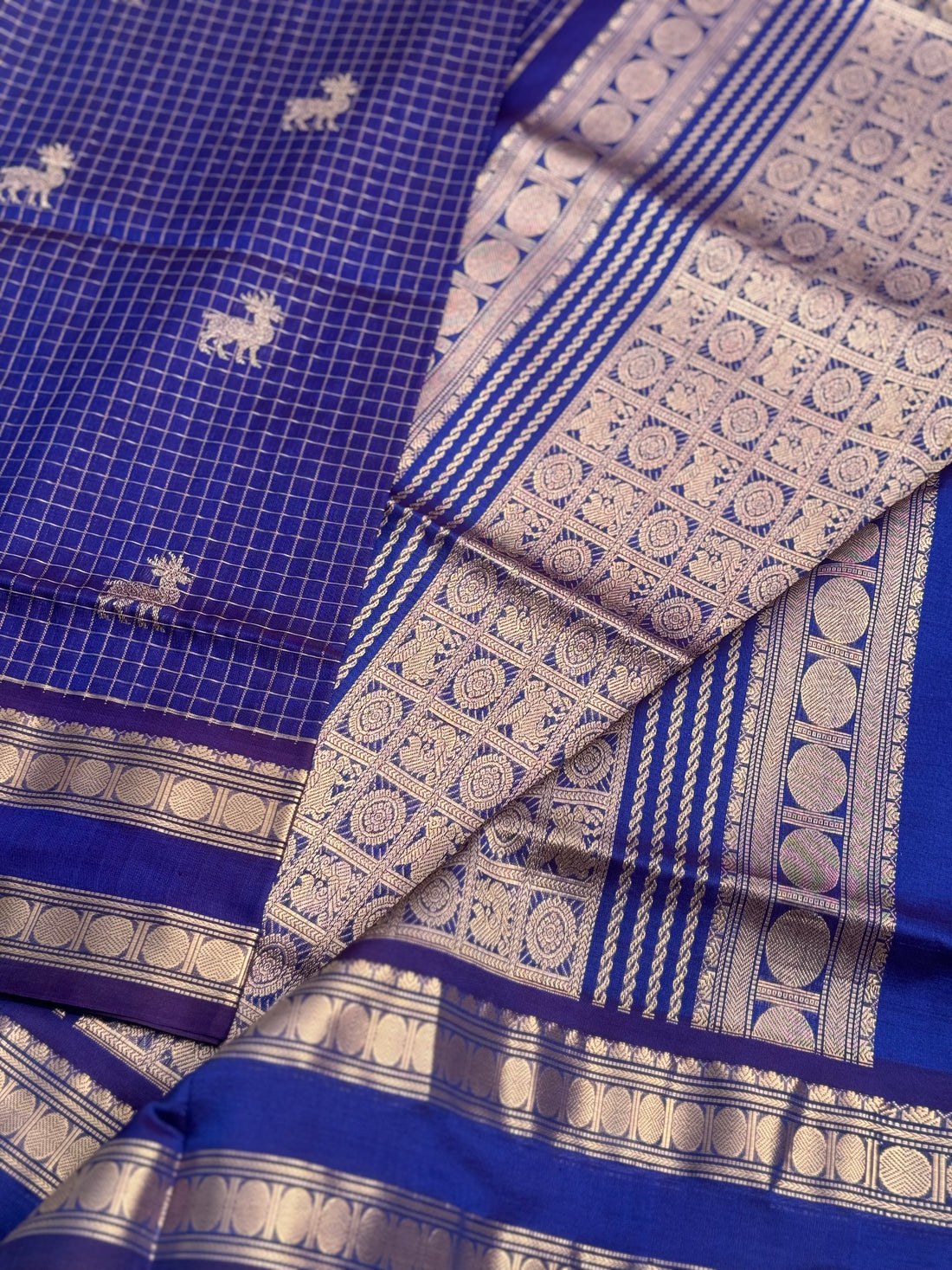 A gorgeous blue shade handwoven zari checks with deer motifs Kanchi silk cotton saree