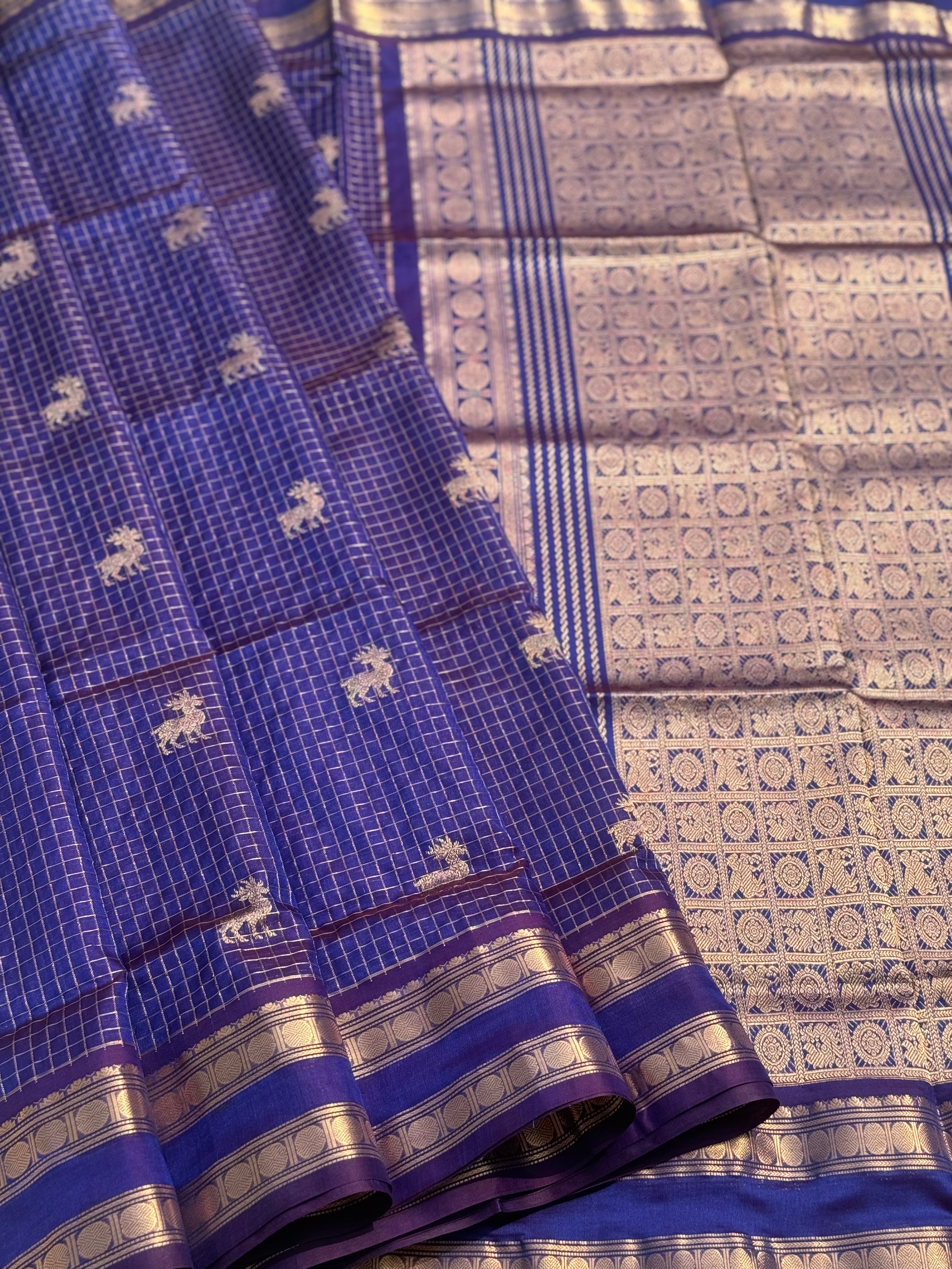 A gorgeous blue shade handwoven zari checks with deer motifs Kanchi silk cotton saree