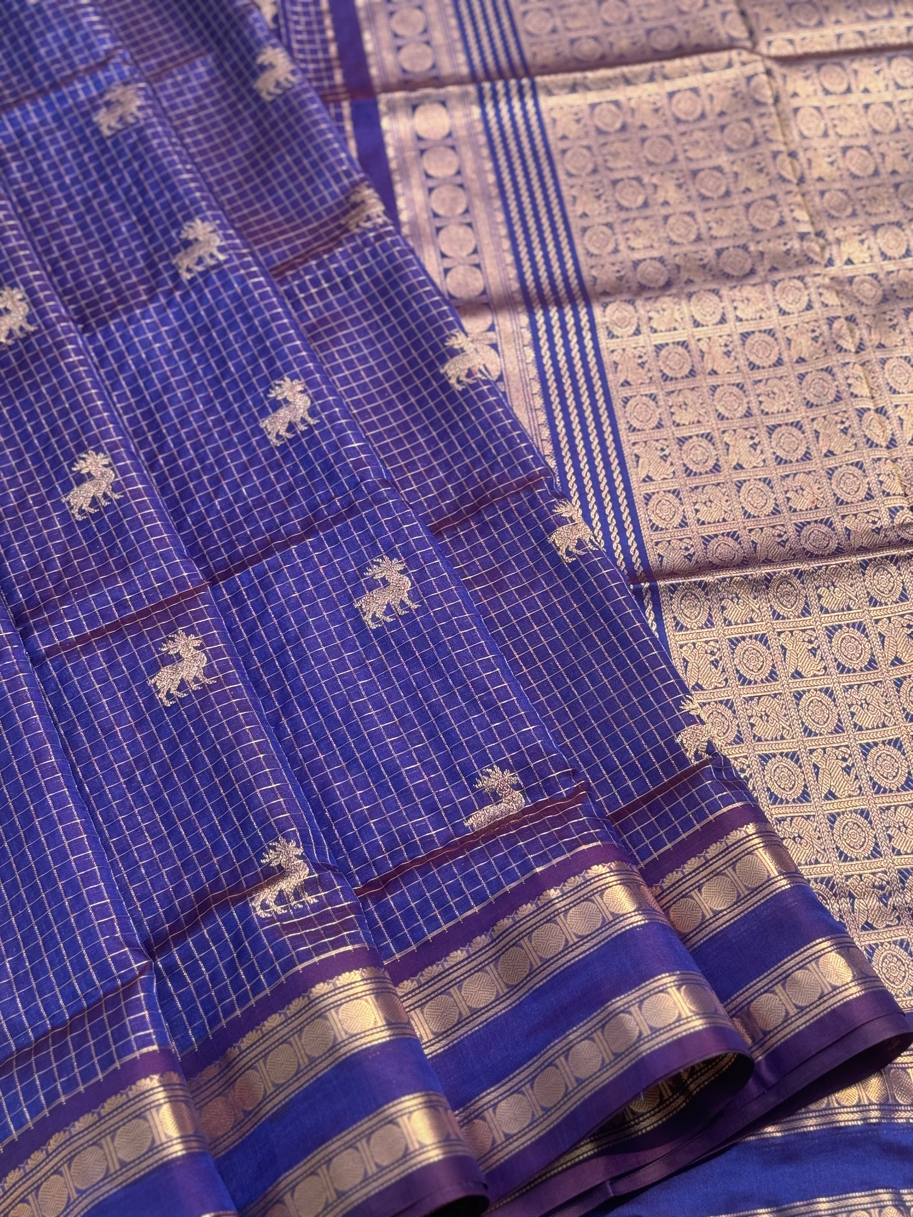 A gorgeous blue shade handwoven zari checks with deer motifs Kanchi silk cotton saree