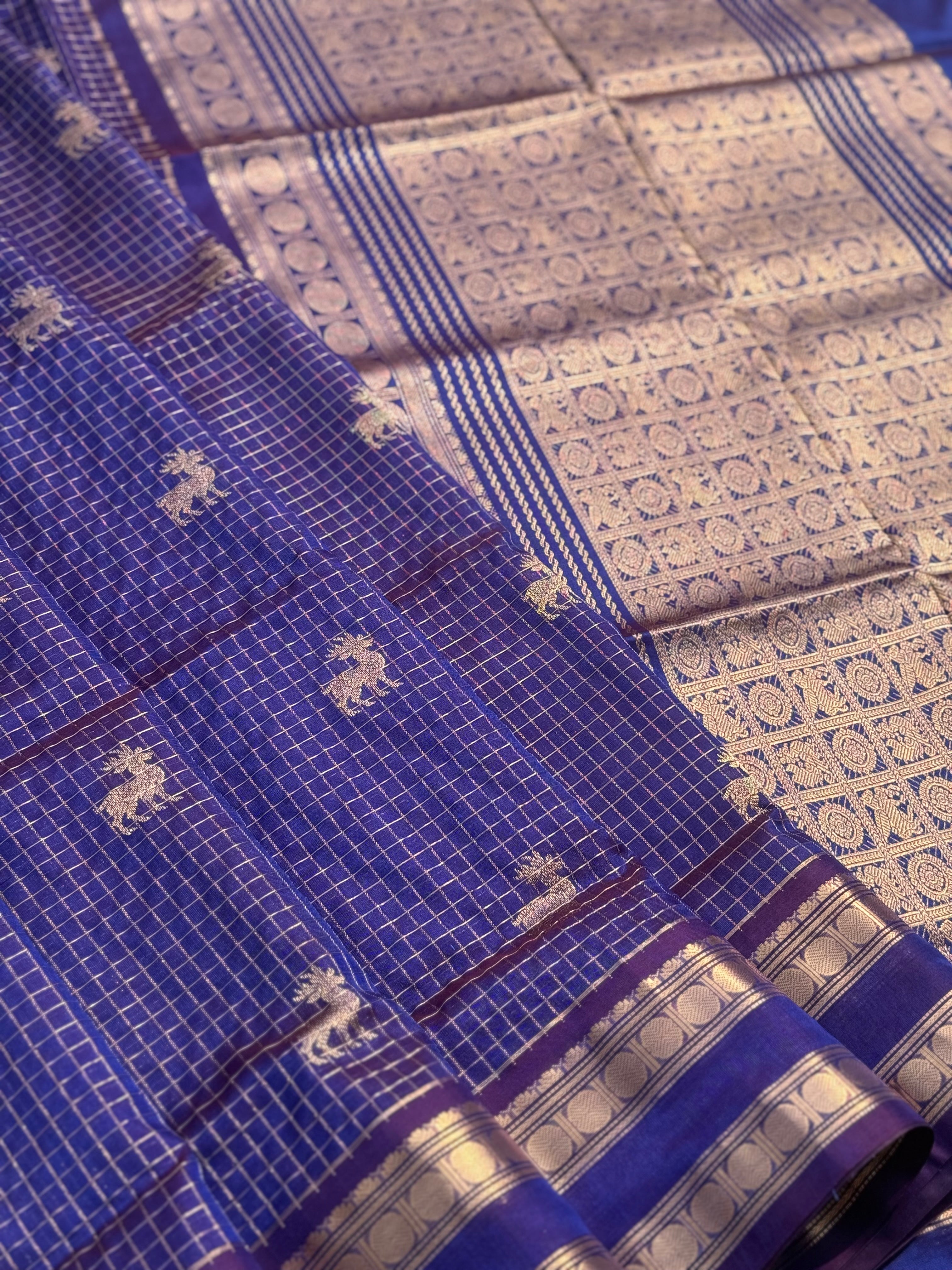 A gorgeous blue shade handwoven zari checks with deer motifs Kanchi silk cotton saree