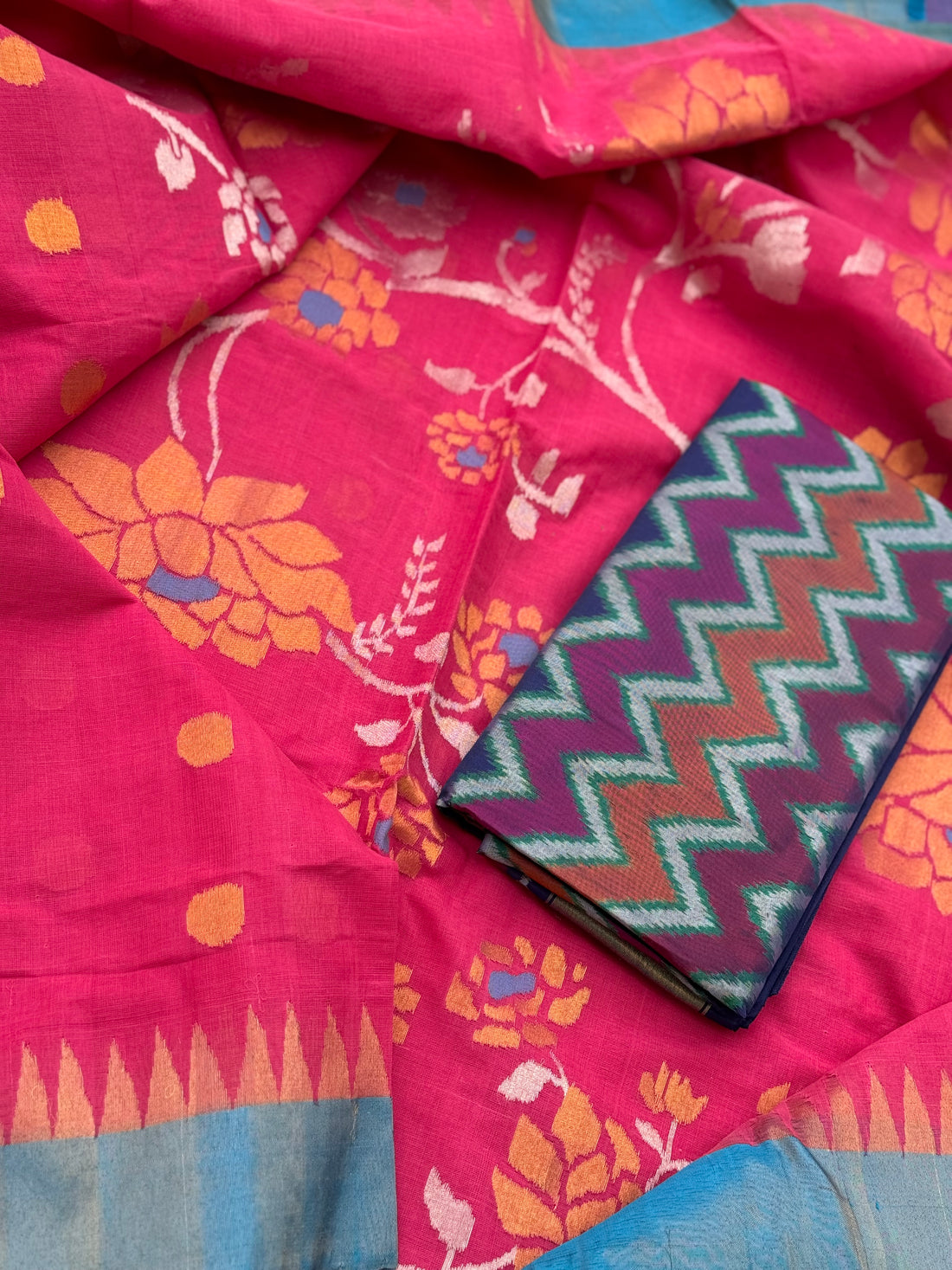 A gorgeous pink with blue Ponduru khadi Jaal jamdani saree