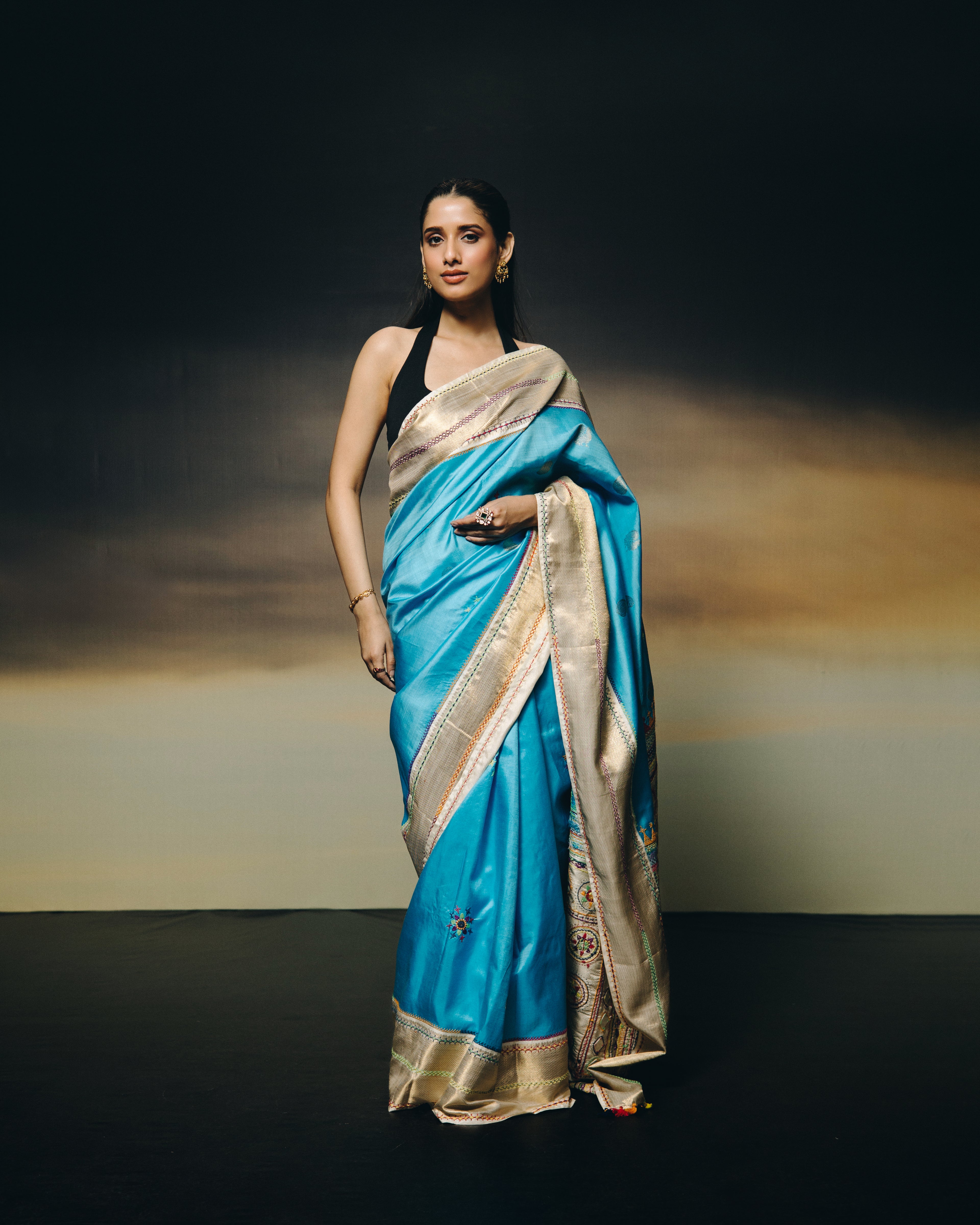 handwoven pure kanchivaram silk saree with korvai borders adorned with an exquisite handmade lambani mirror work