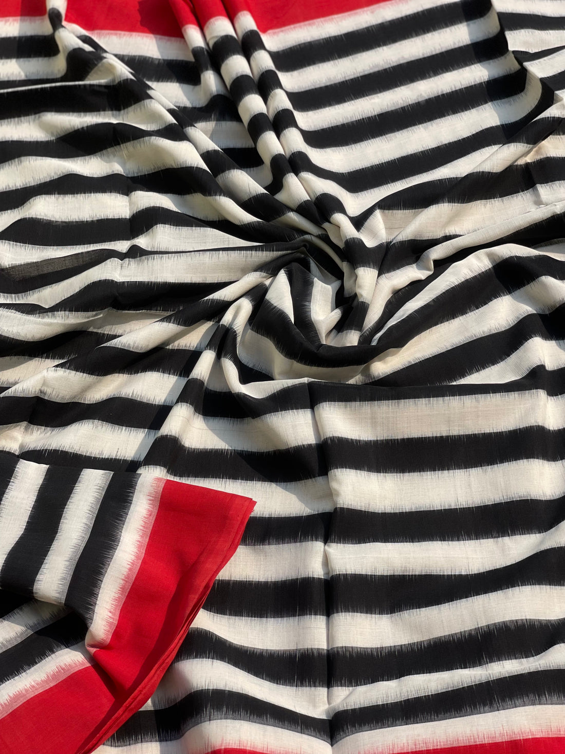 A Contemporary style striped double Ikkat cotton saree