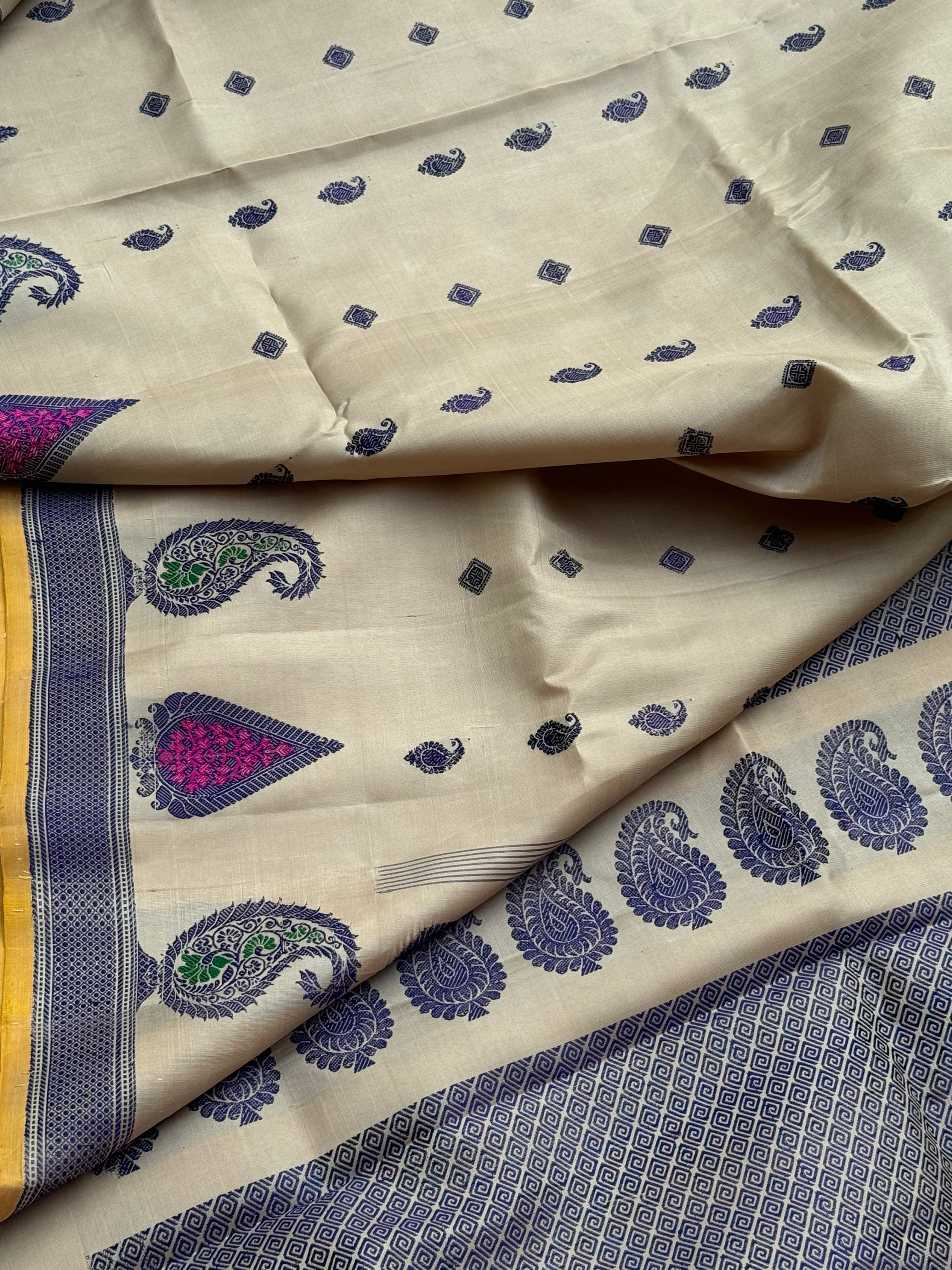 A gorgeous No Zari ivory with lavender with pink handwoven soft and lustrous gadwal silk saree