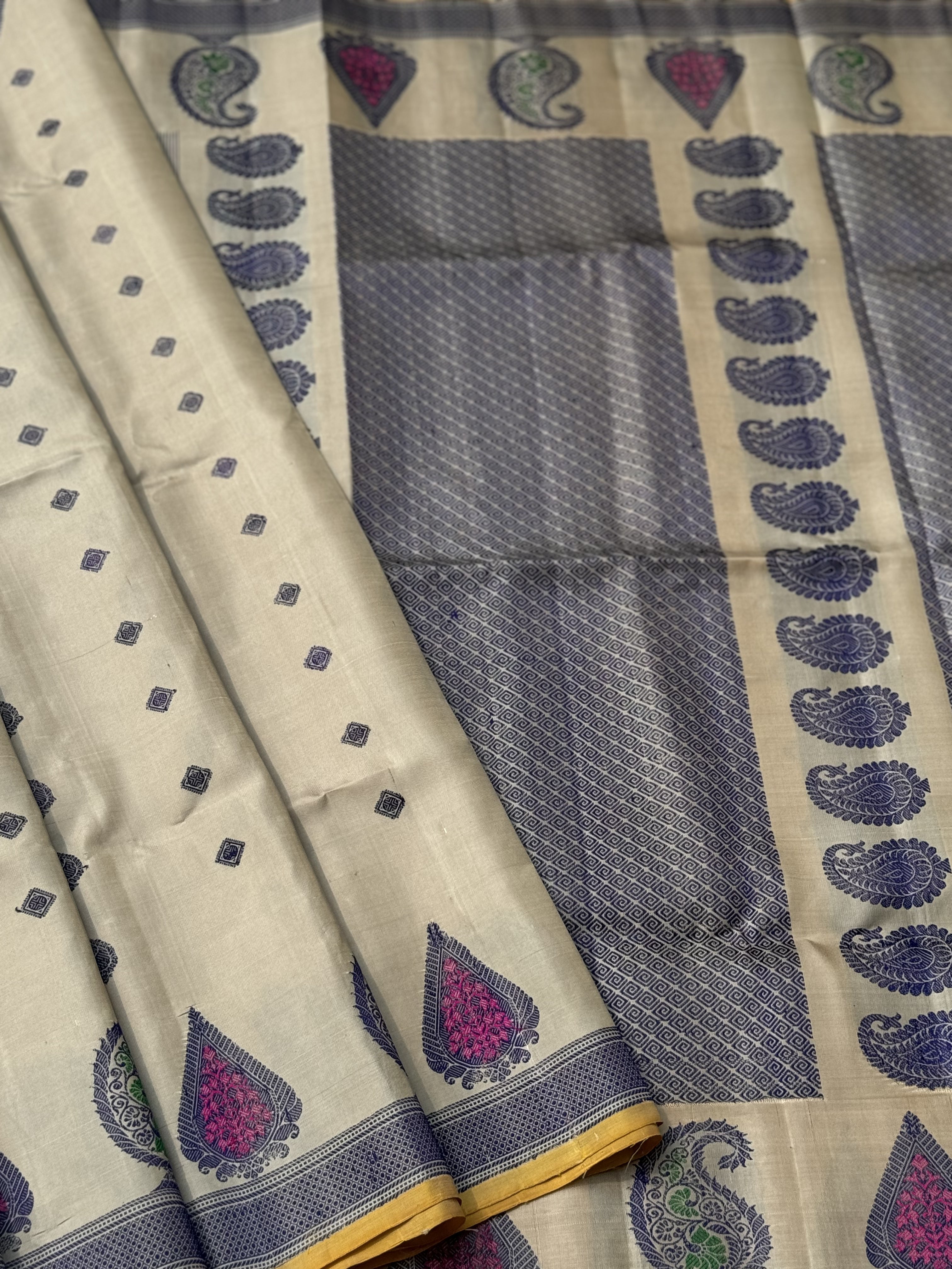 A gorgeous No Zari ivory with lavender with pink handwoven soft and lustrous gadwal silk saree