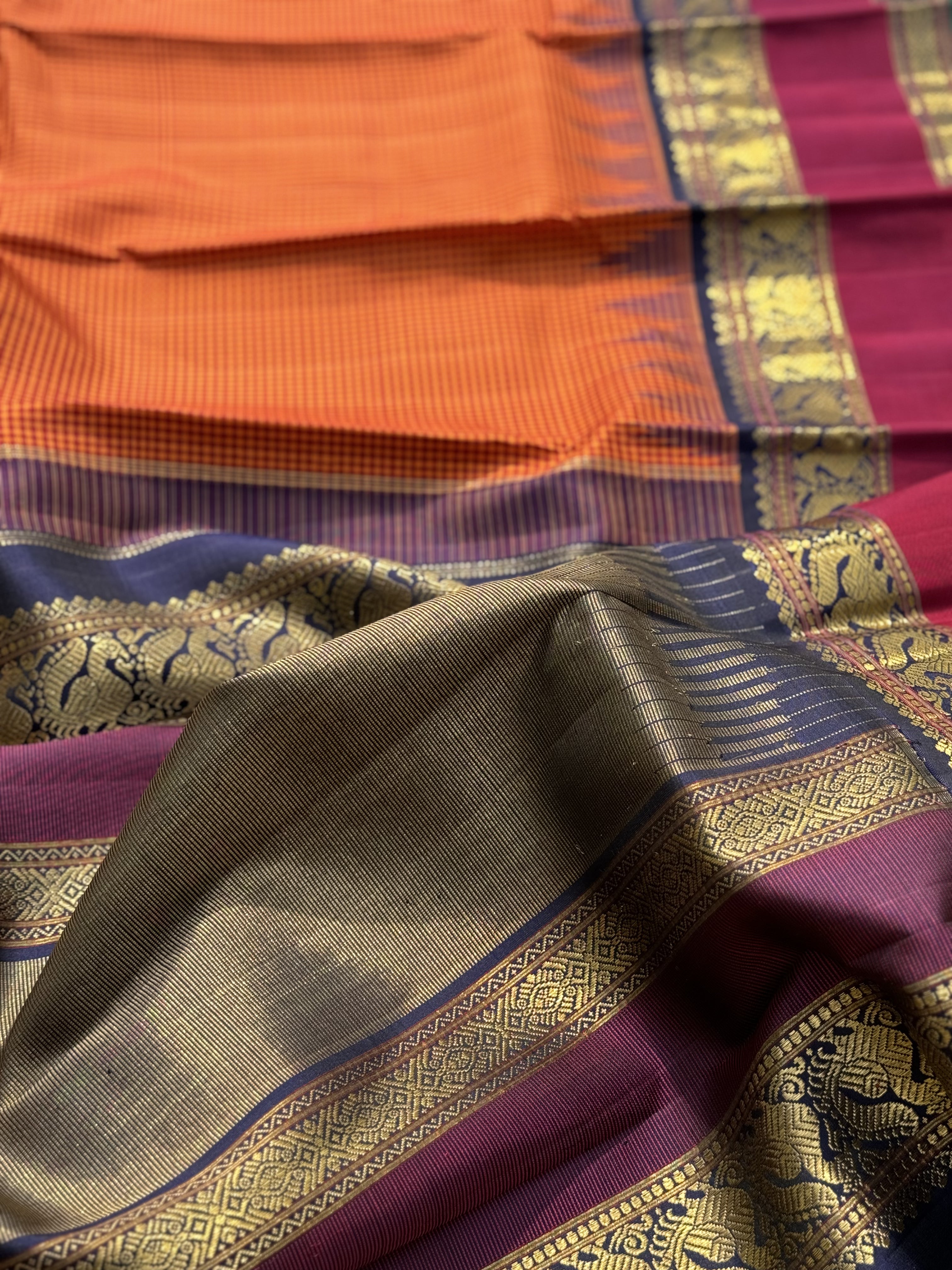 KADHAMBAM KANCHI - A grandeur burnt orange with deep navy blue korvai temple  and zari border kanchivaram silk SAREE
