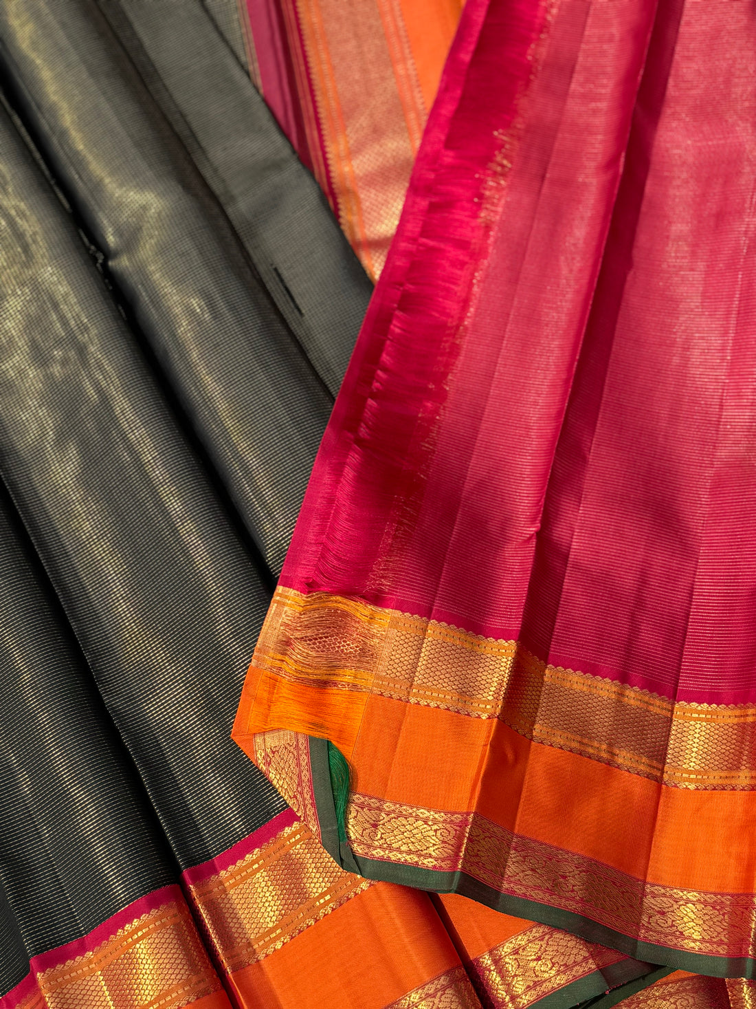 A granduer stark black with orange zari muthu seer kanchivaram silk saree