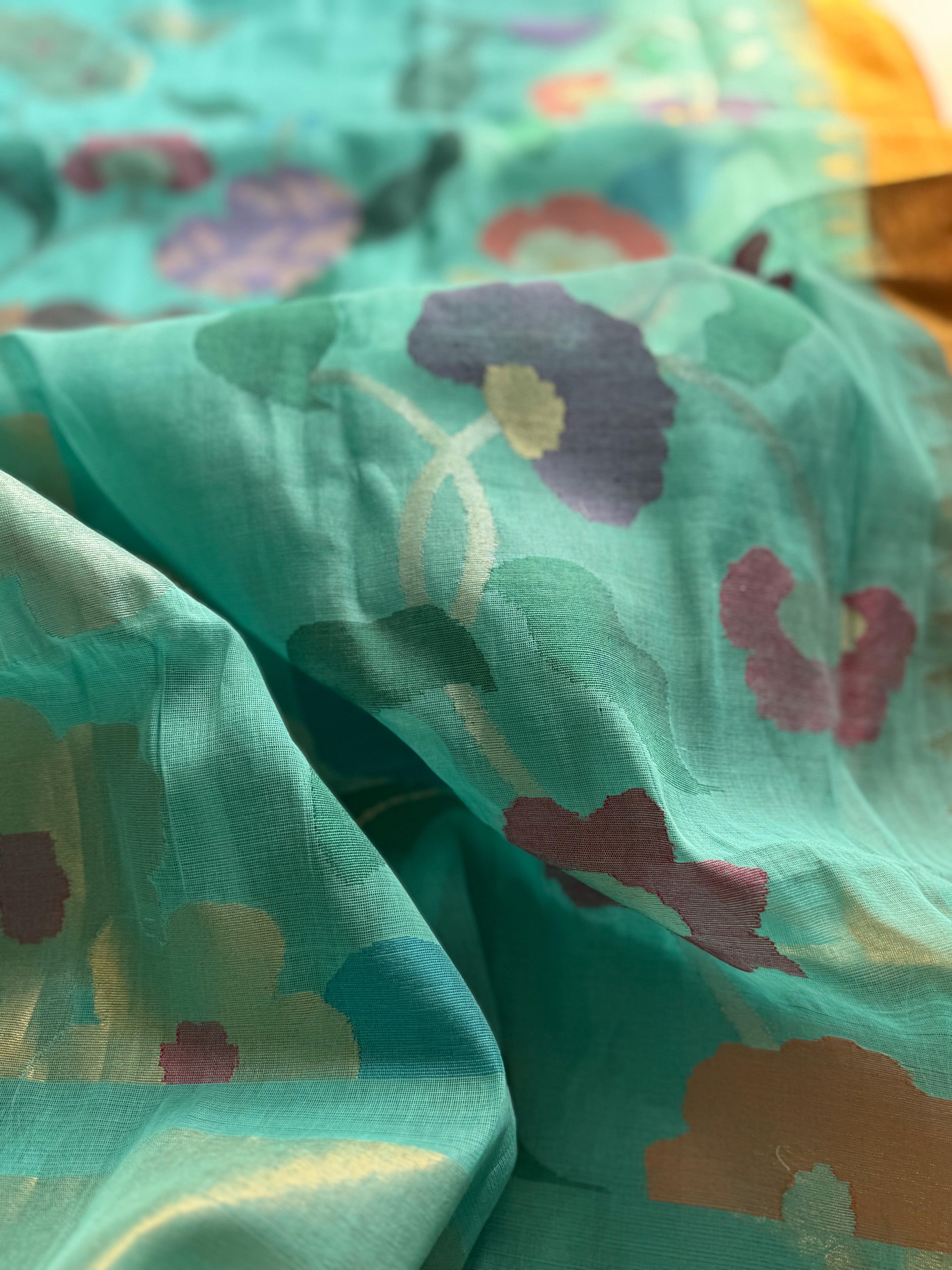A gorgeous pastel foam blue shade handspun ponduru Khadhi jamdani cotton saree