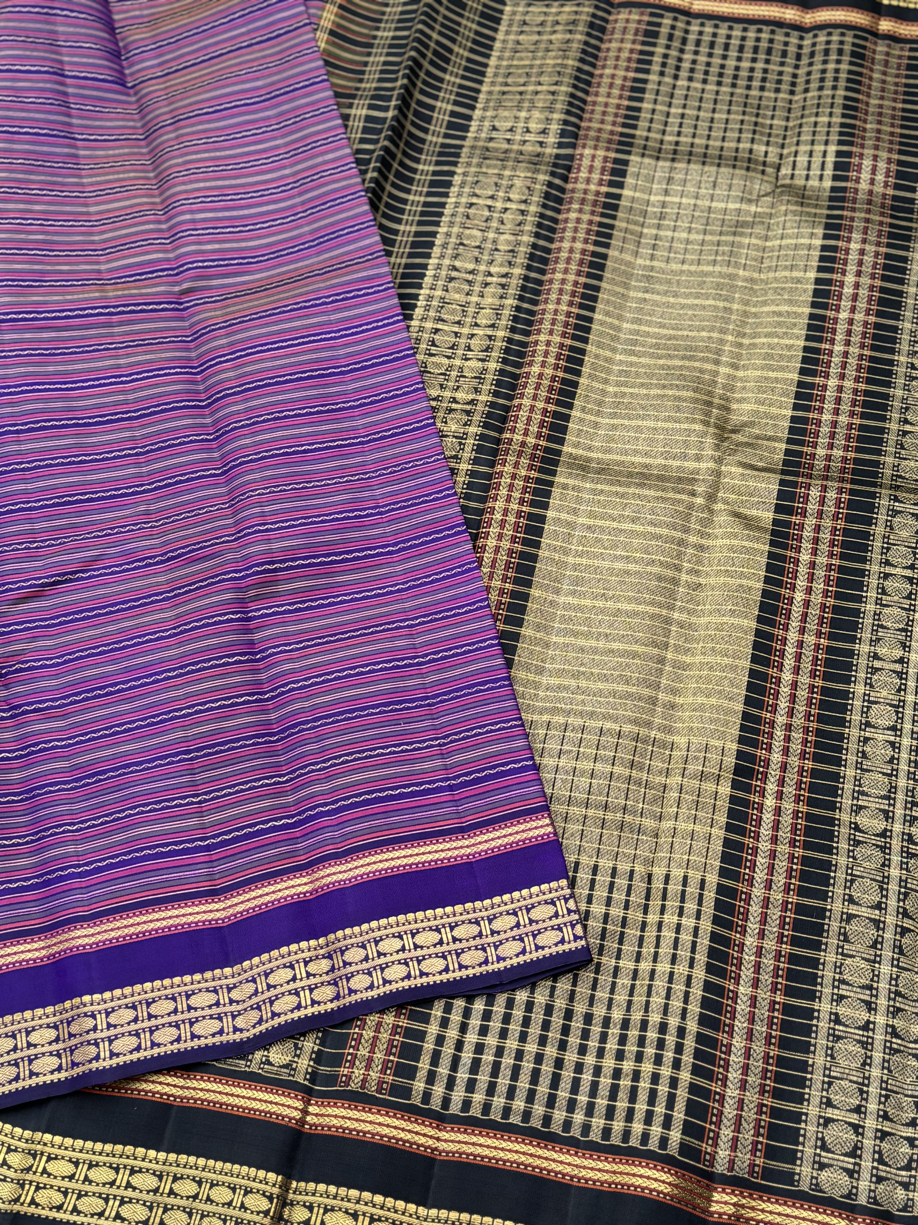A stunner varisaipettu kanchivaram silk saree in purple with black