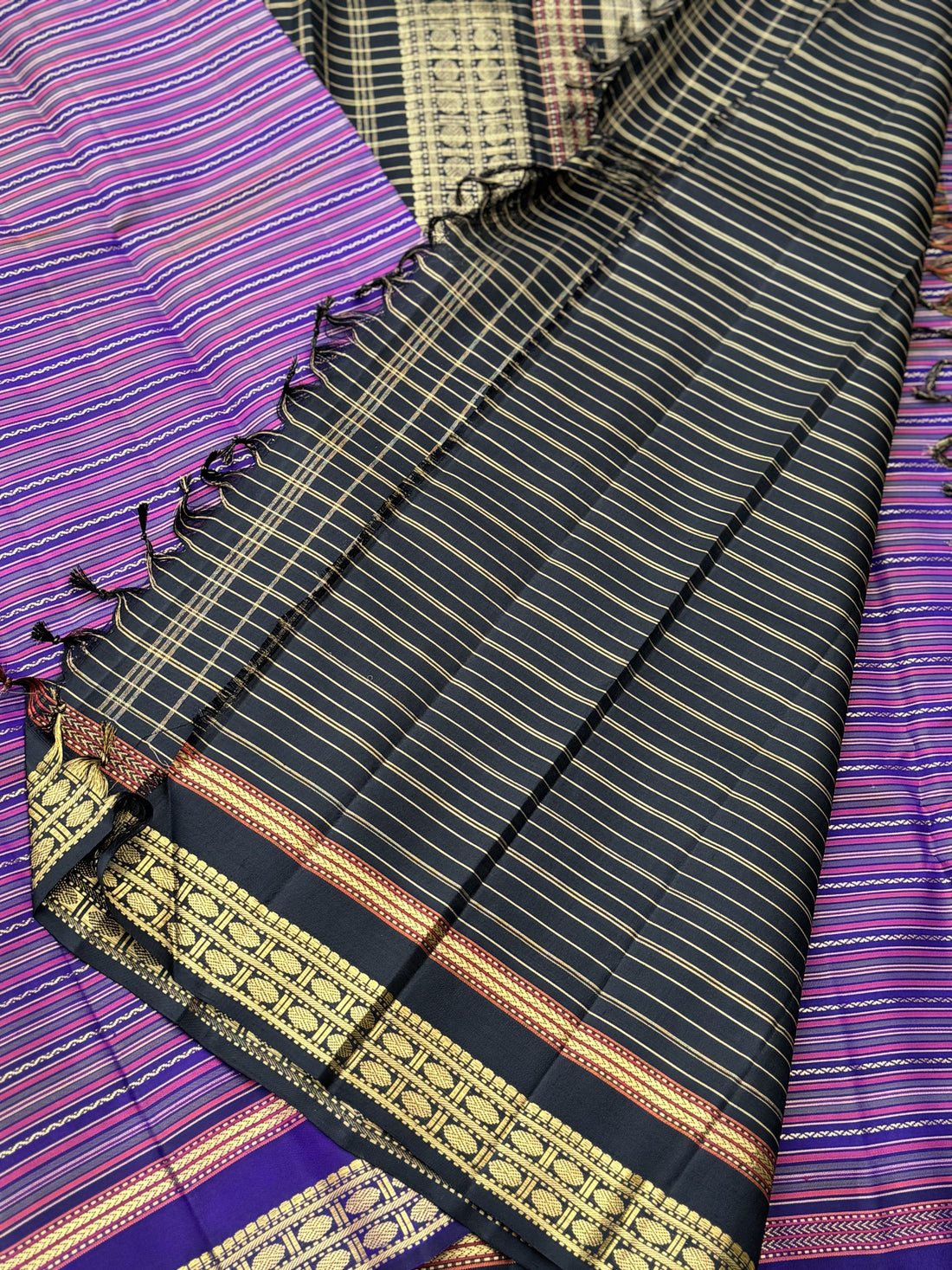 A stunner varisaipettu kanchivaram silk saree in purple with black