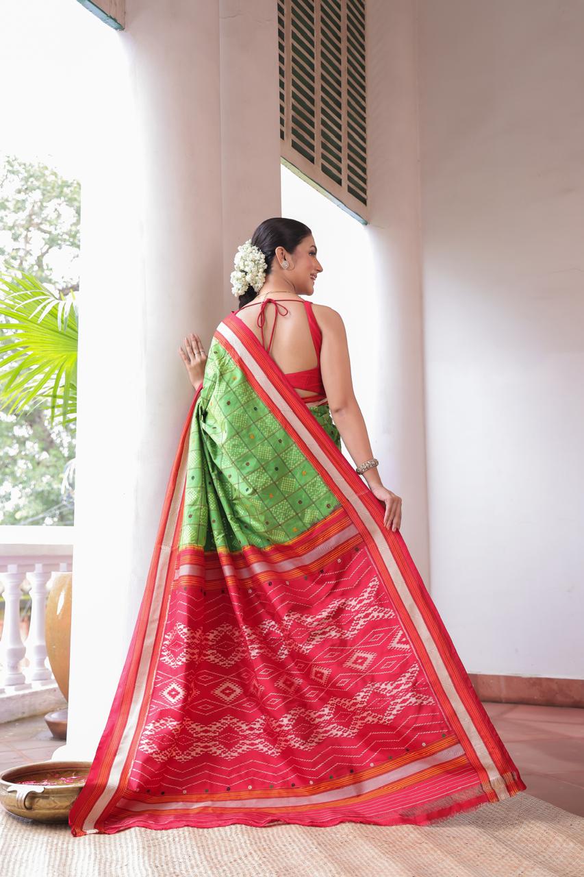 A Fern Green shade revival vintage recreated masterpiece created by a national award winning masterweaver, a highly skilled craftsmanship silk ikkat saree