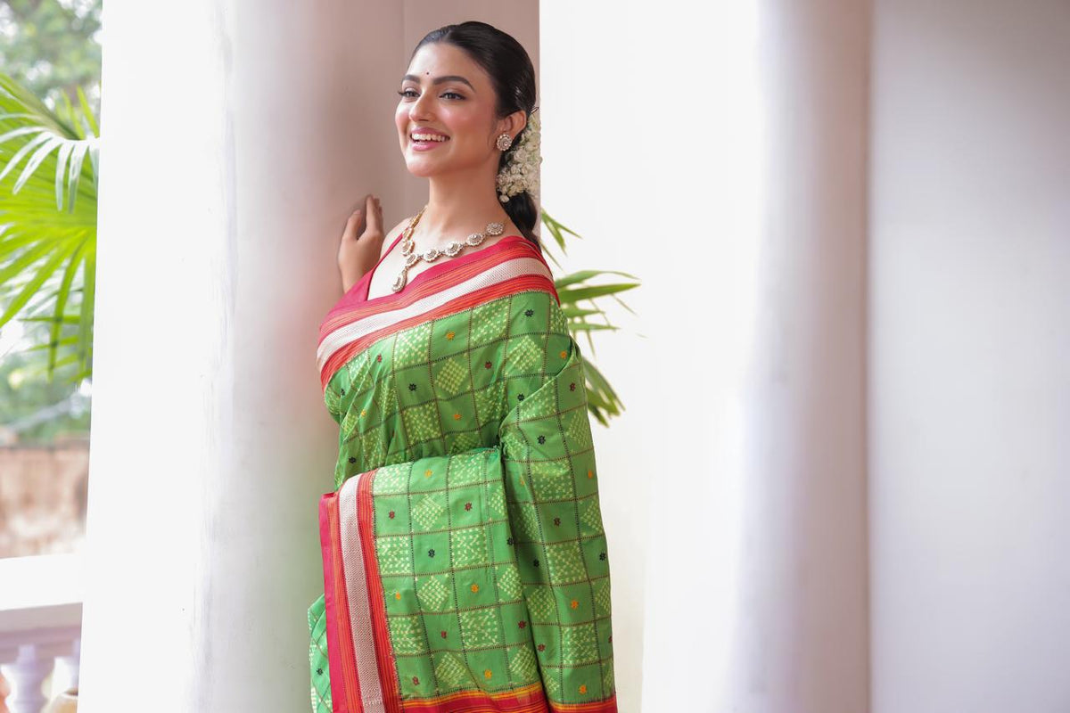 A Fern Green shade revival vintage recreated masterpiece created by a national award winning masterweaver, a highly skilled craftsmanship silk ikkat saree