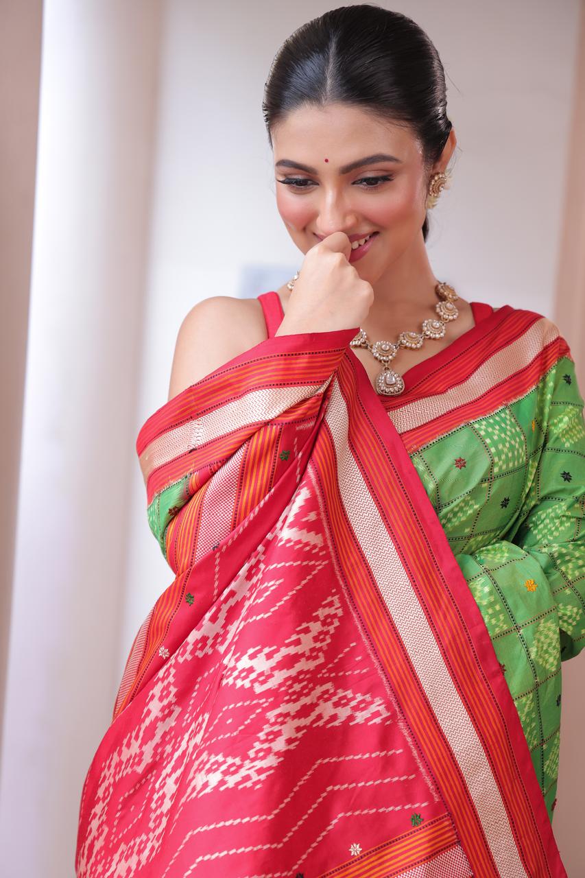 A Fern Green shade revival vintage recreated masterpiece created by a national award winning masterweaver, a highly skilled craftsmanship silk ikkat saree