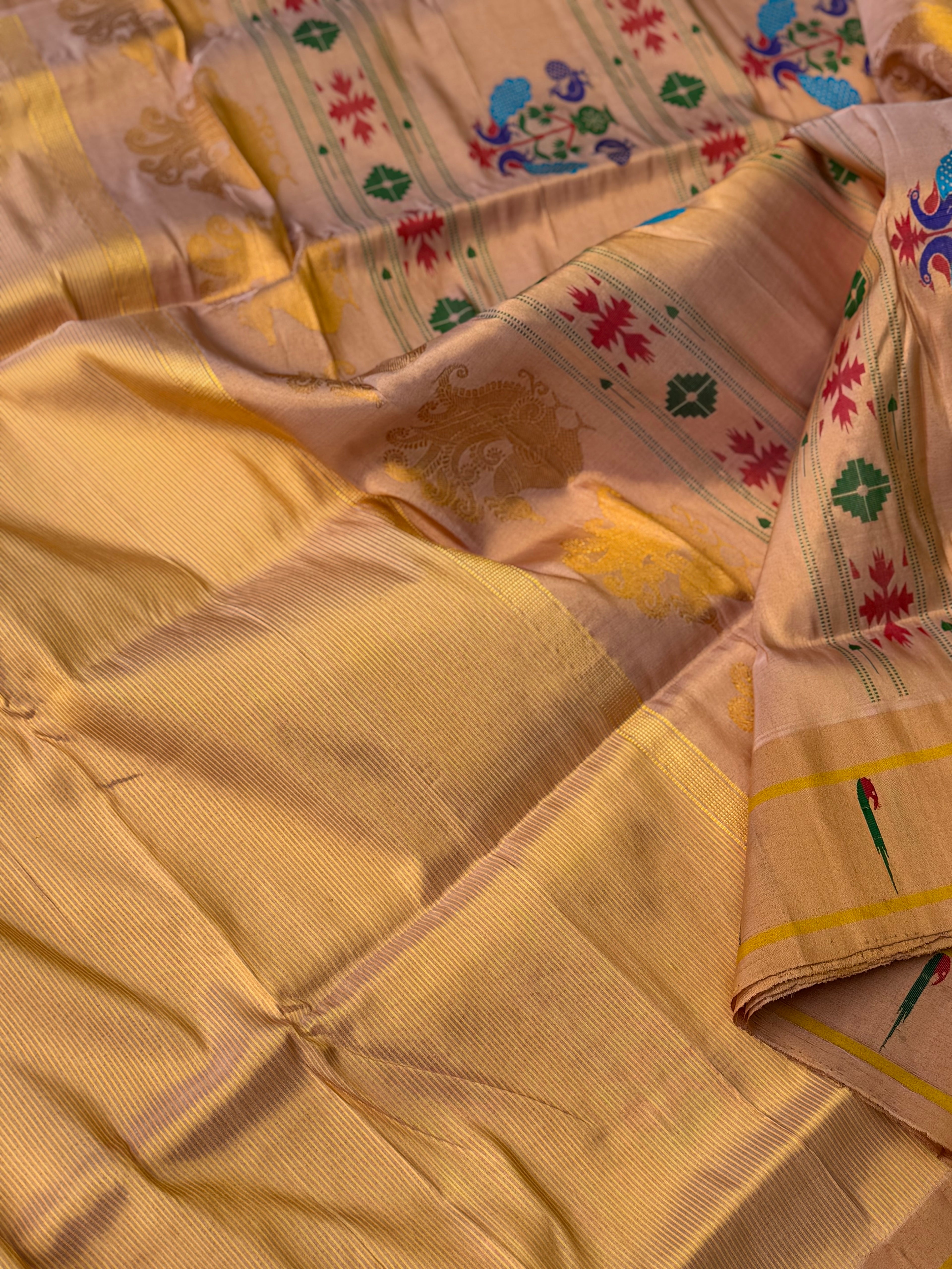 A stunner showstopper Handloom paithani tissue silk saree with single muniya border