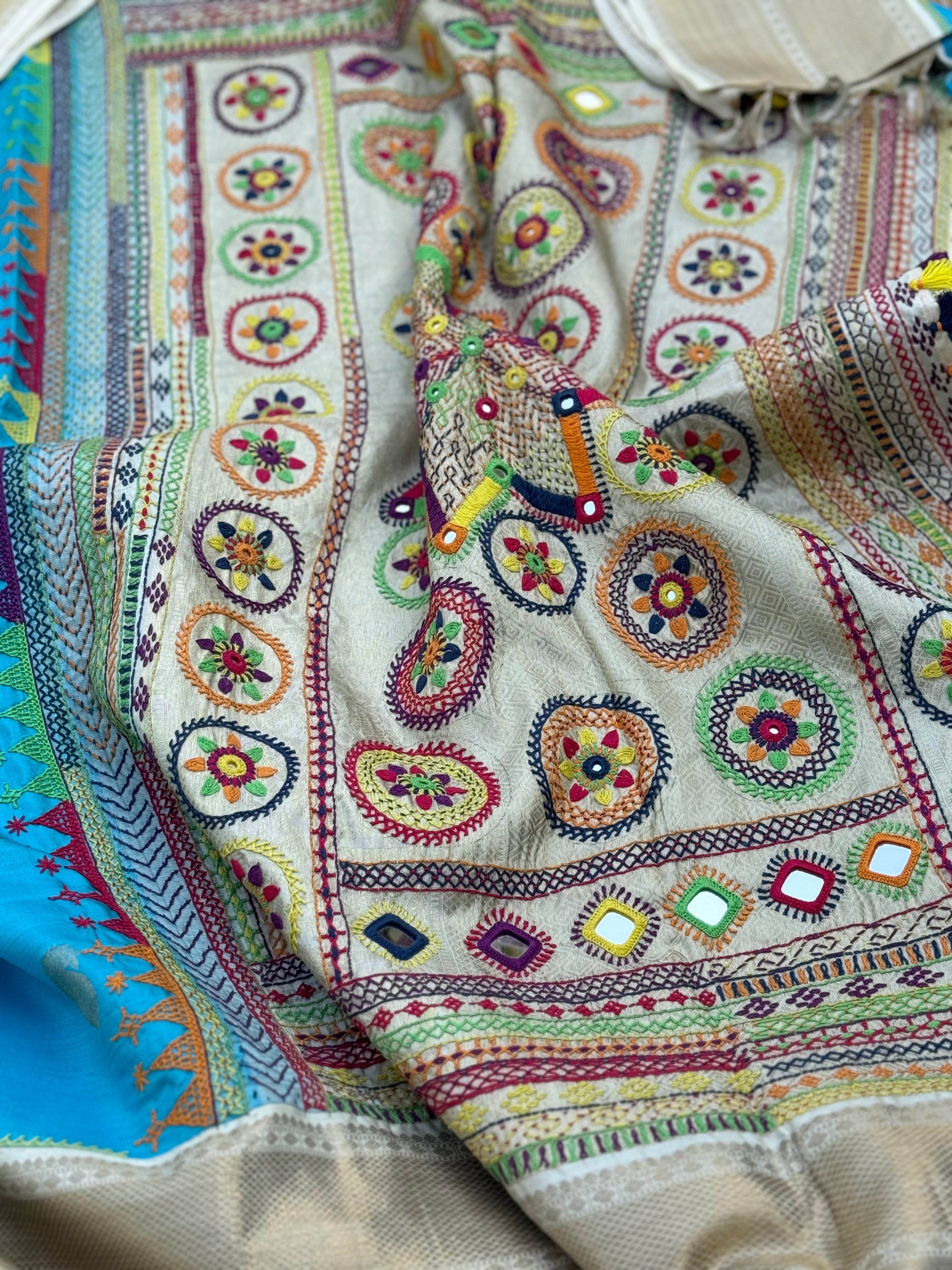 handwoven pure kanchivaram silk saree with korvai borders adorned with an exquisite handmade lambani mirror work