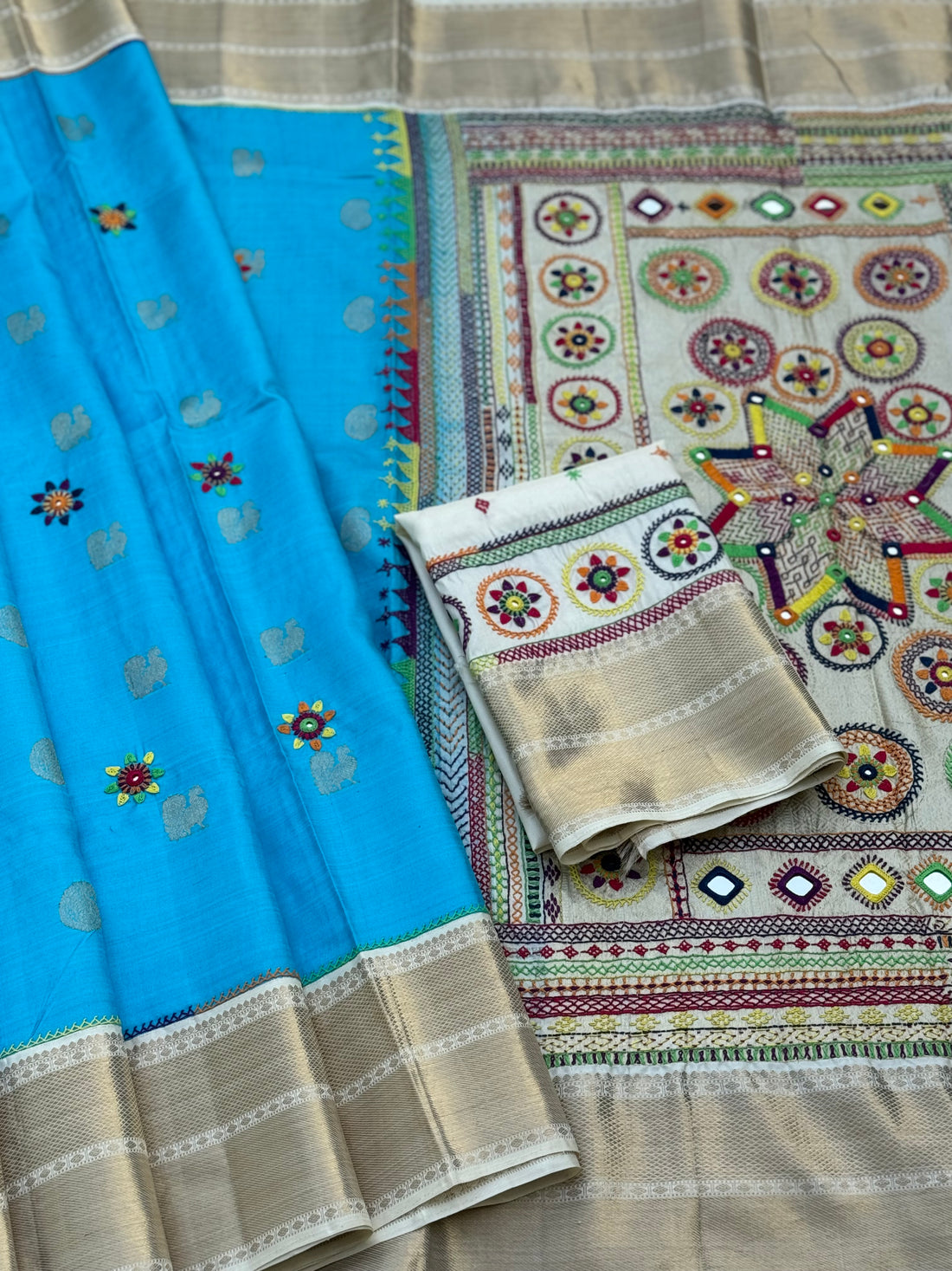 handwoven pure kanchivaram silk saree with korvai borders adorned with an exquisite handmade lambani mirror work