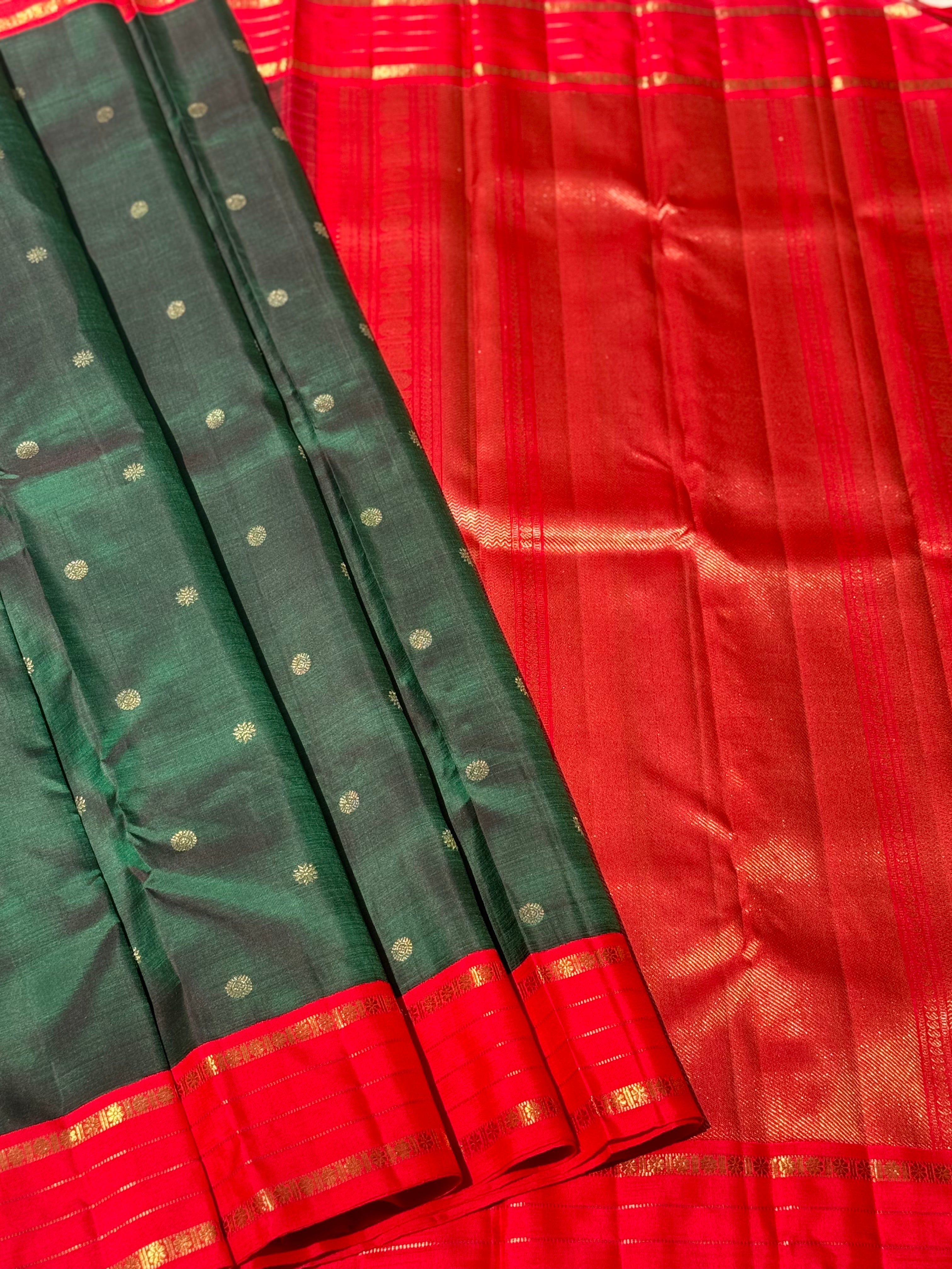 KADHAMBAM- The stunner handwoven bottle green with red korvai kanchivaram silk saree