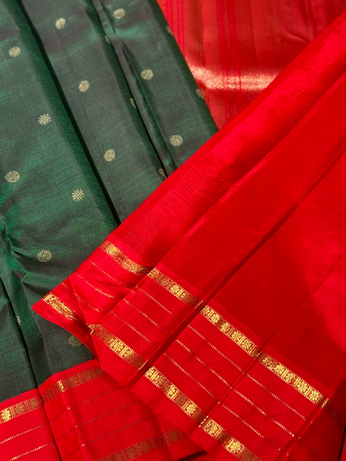 KADHAMBAM- The stunner handwoven bottle green with red korvai kanchivaram silk saree