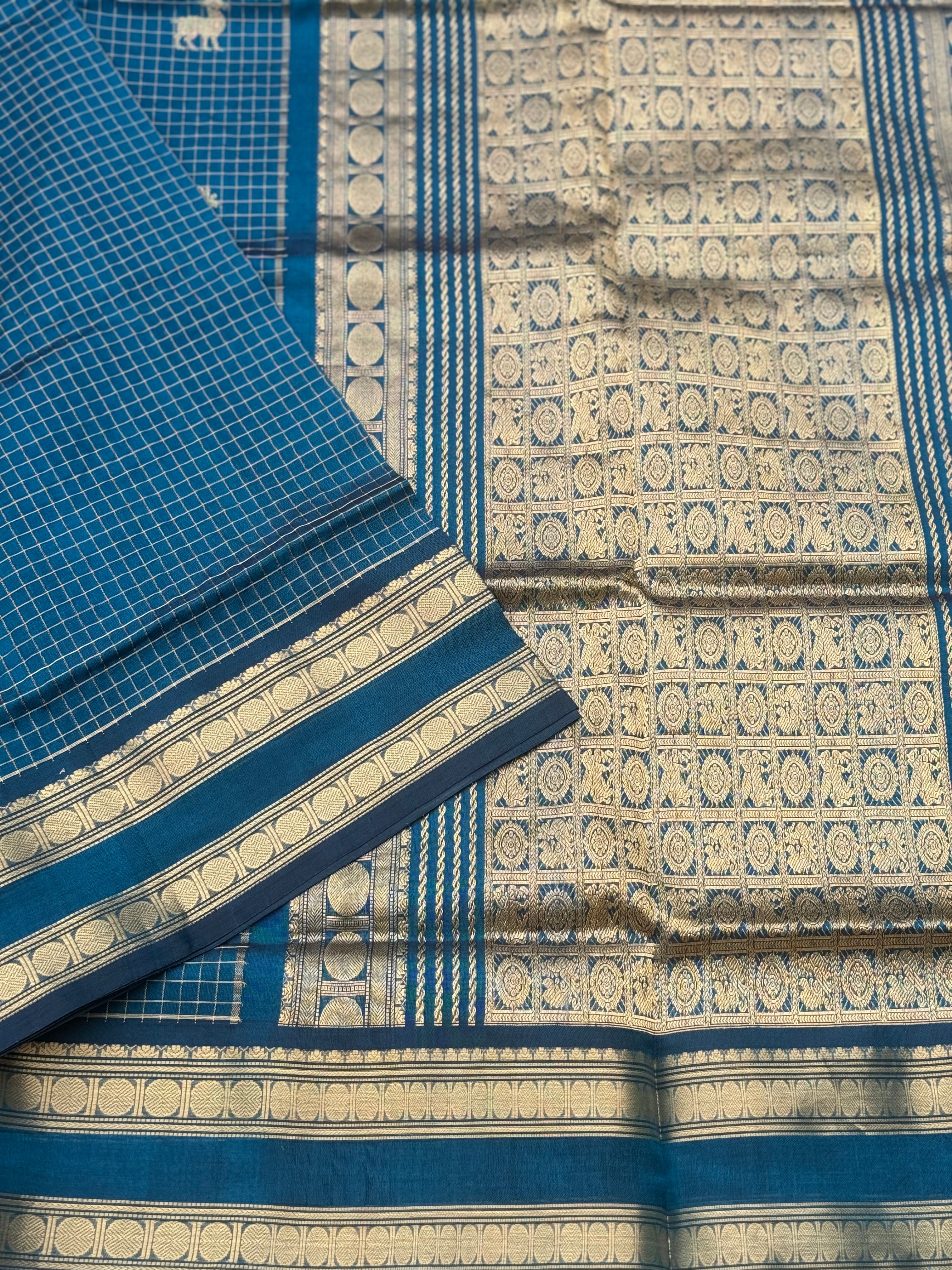 A gorgeous peacock blue shade handwoven zari checks with deer motifs Kanchi silk cotton saree