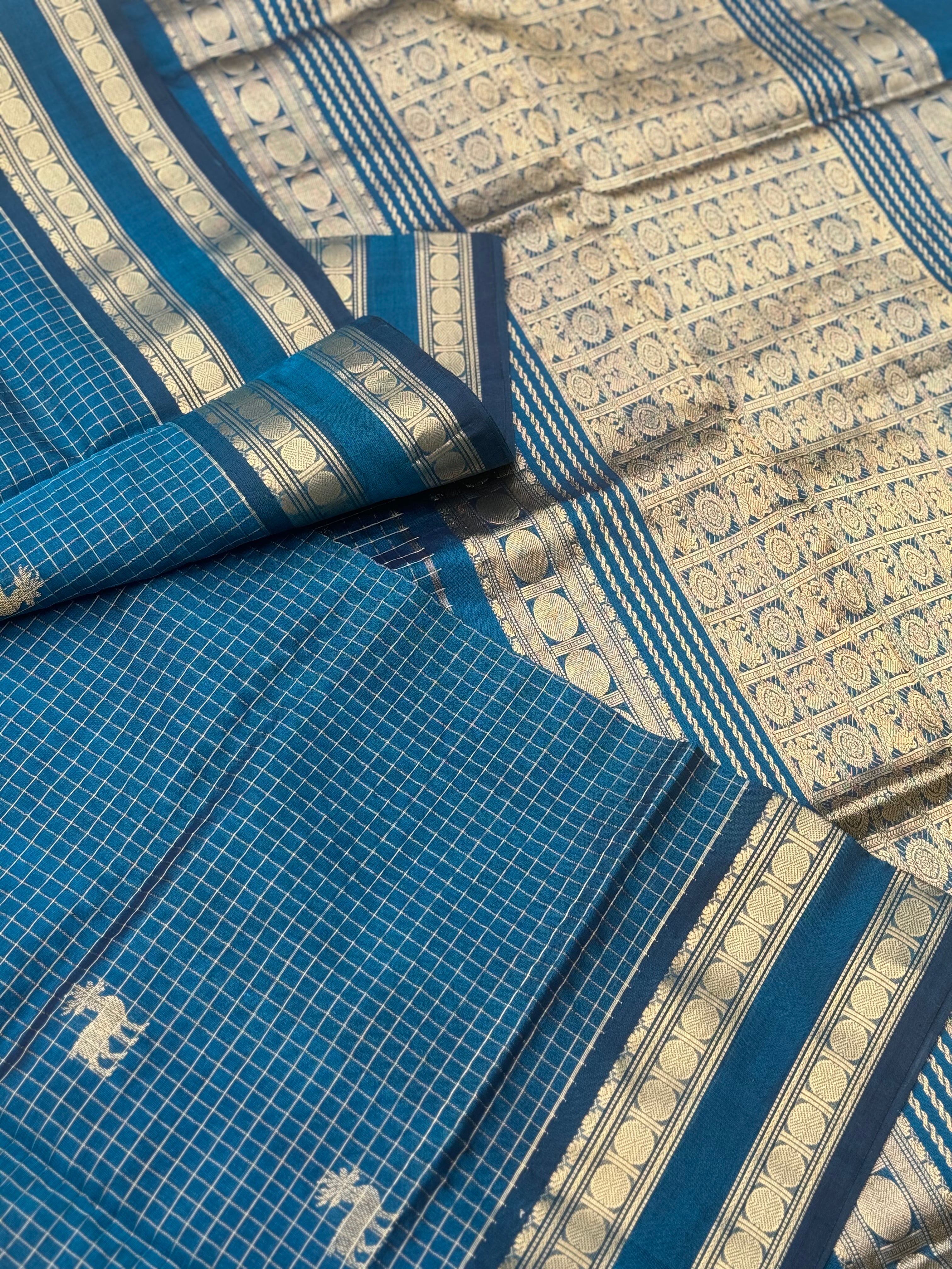 A gorgeous peacock blue shade handwoven zari checks with deer motifs Kanchi silk cotton saree