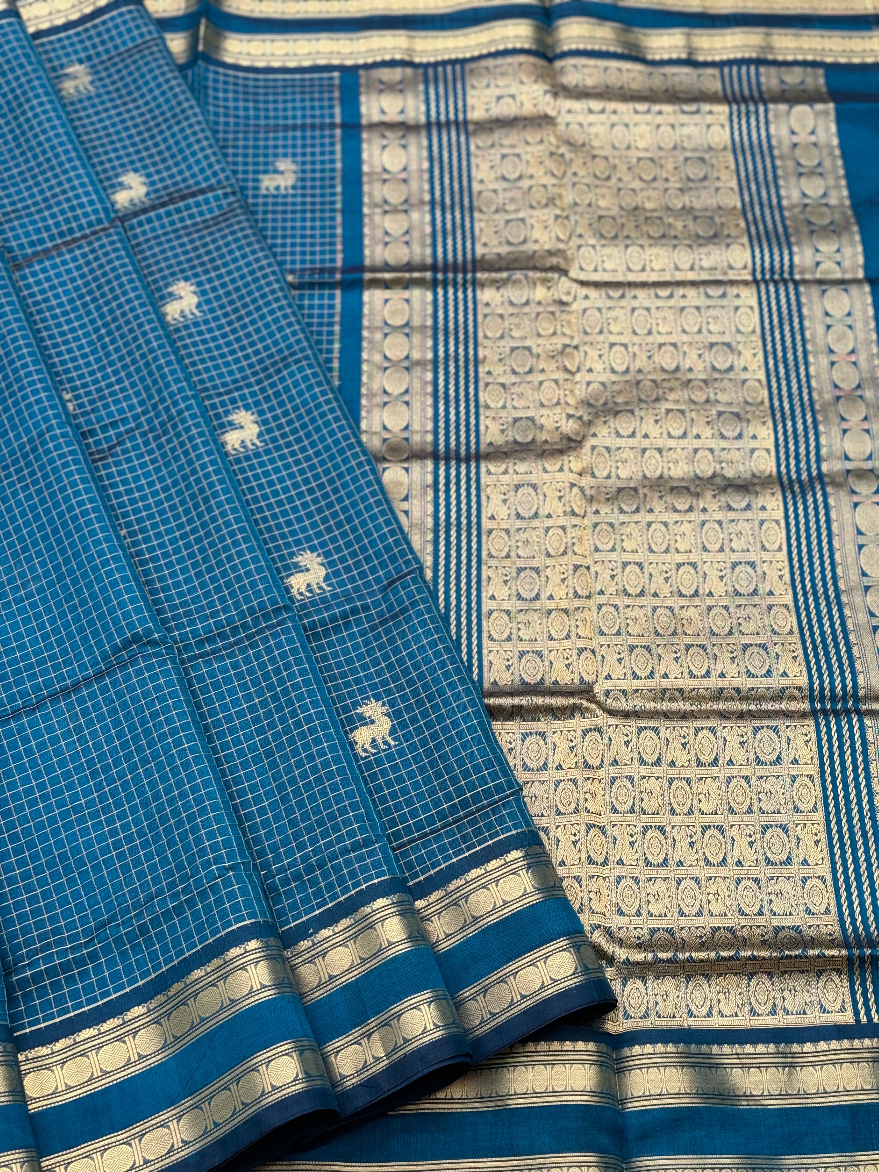 A gorgeous peacock blue shade handwoven zari checks with deer motifs Kanchi silk cotton saree