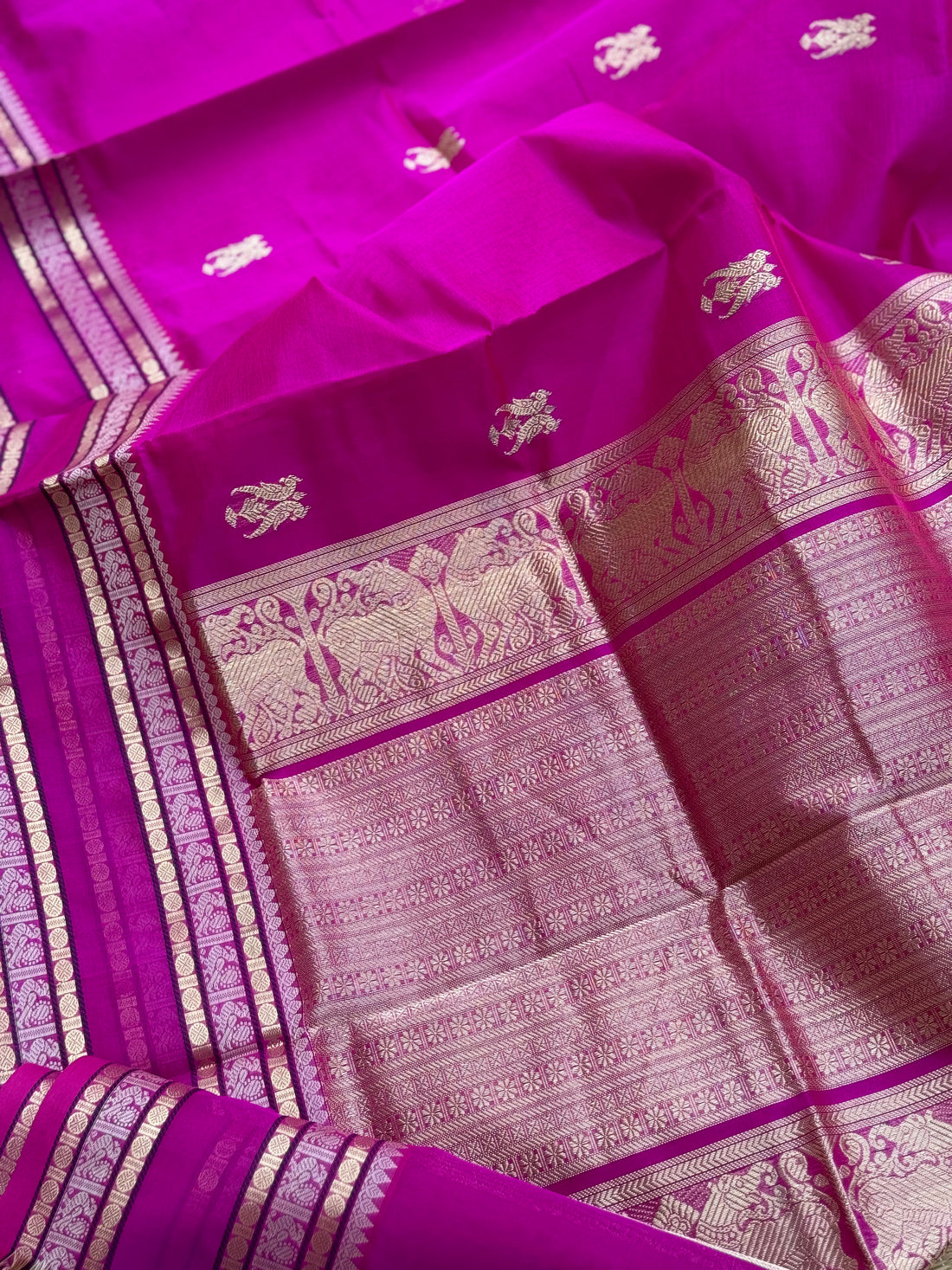 A gorgeous pattuRose pink shade handwoven zari checks with deer motifs Kanchi silk cotton saree