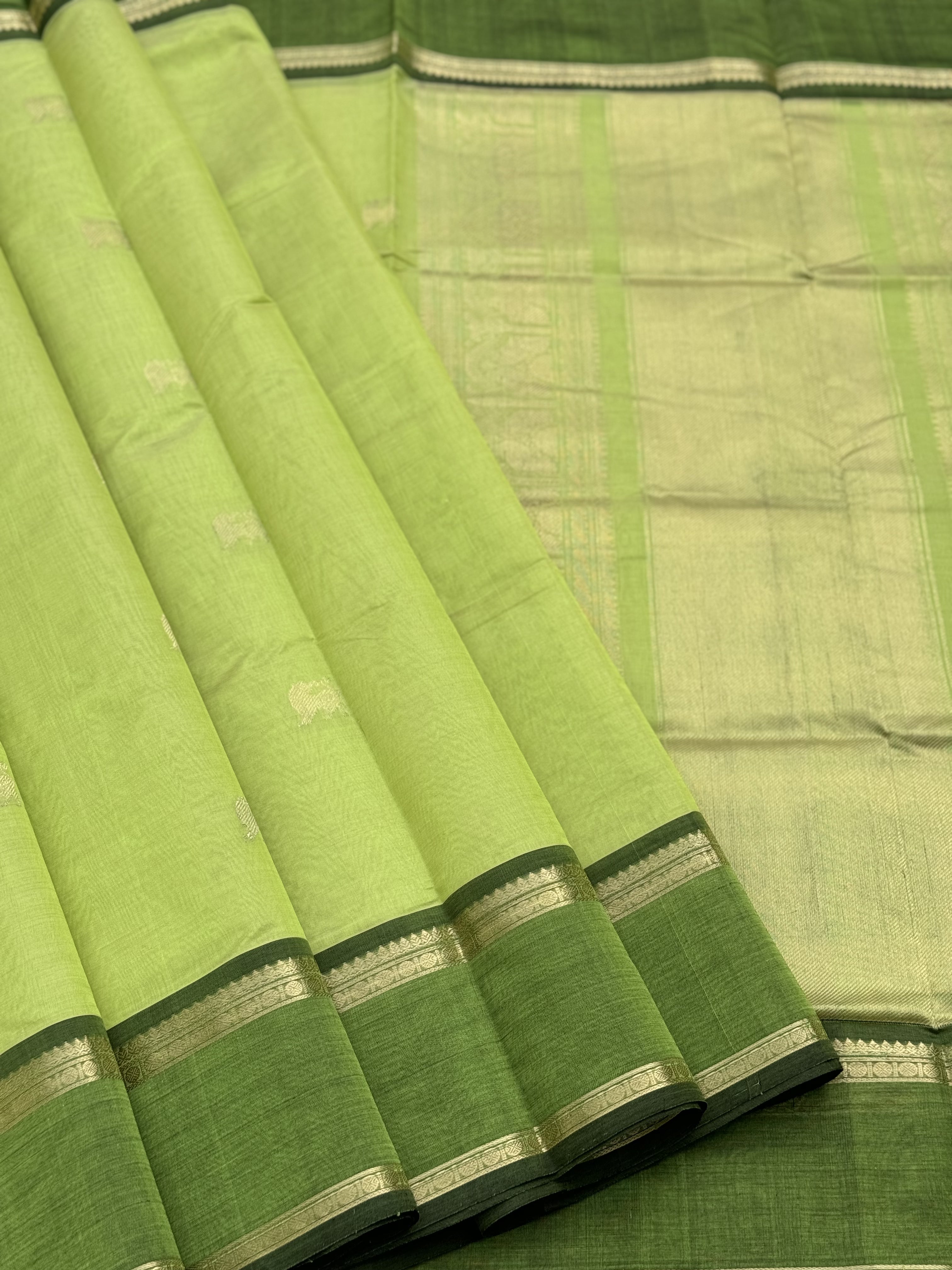 A gorgeous chartreuse green shade handwoven zari Kanchi silk cotton saree