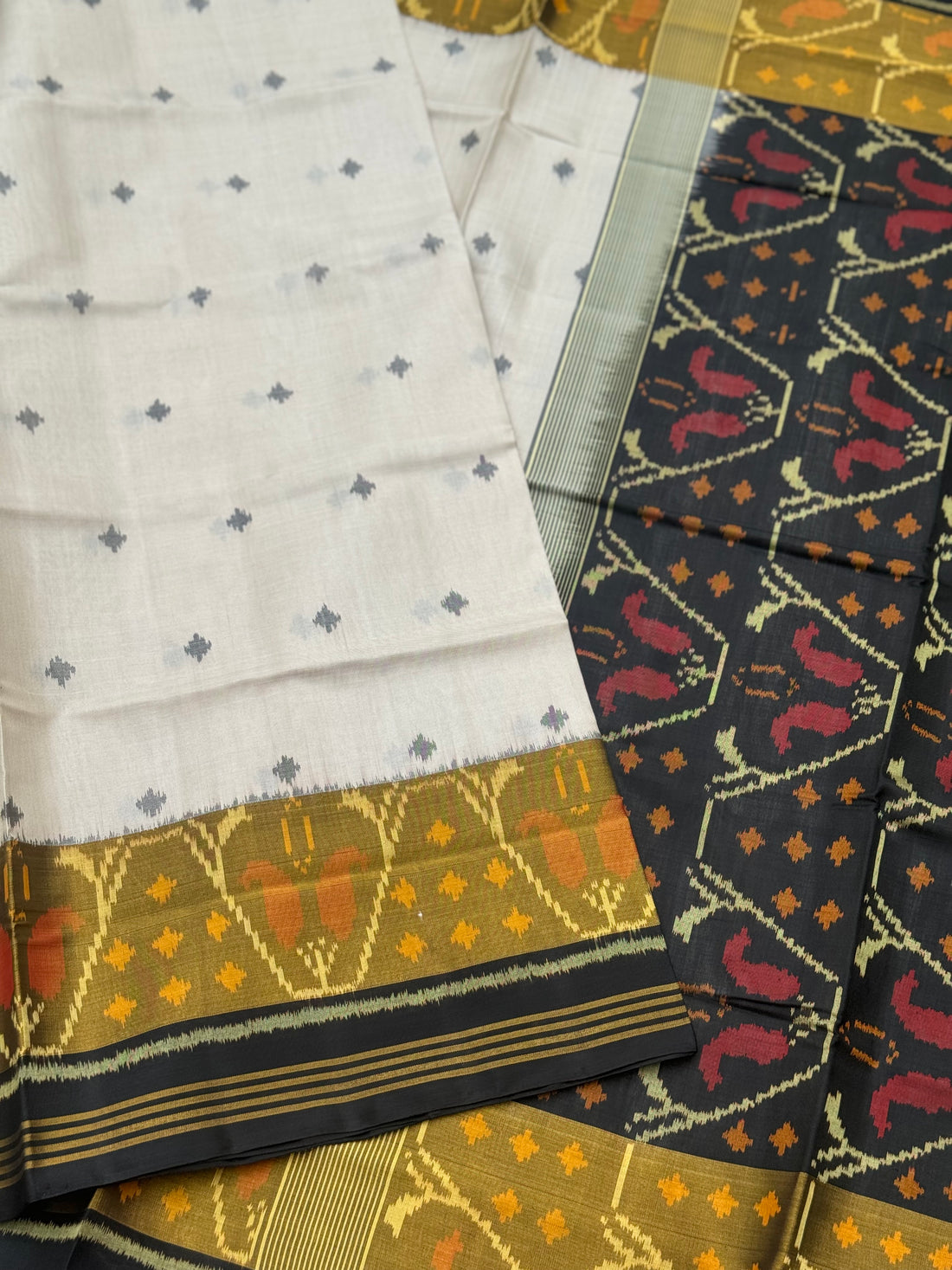 Ivory with black Patola single ikkat silk saree