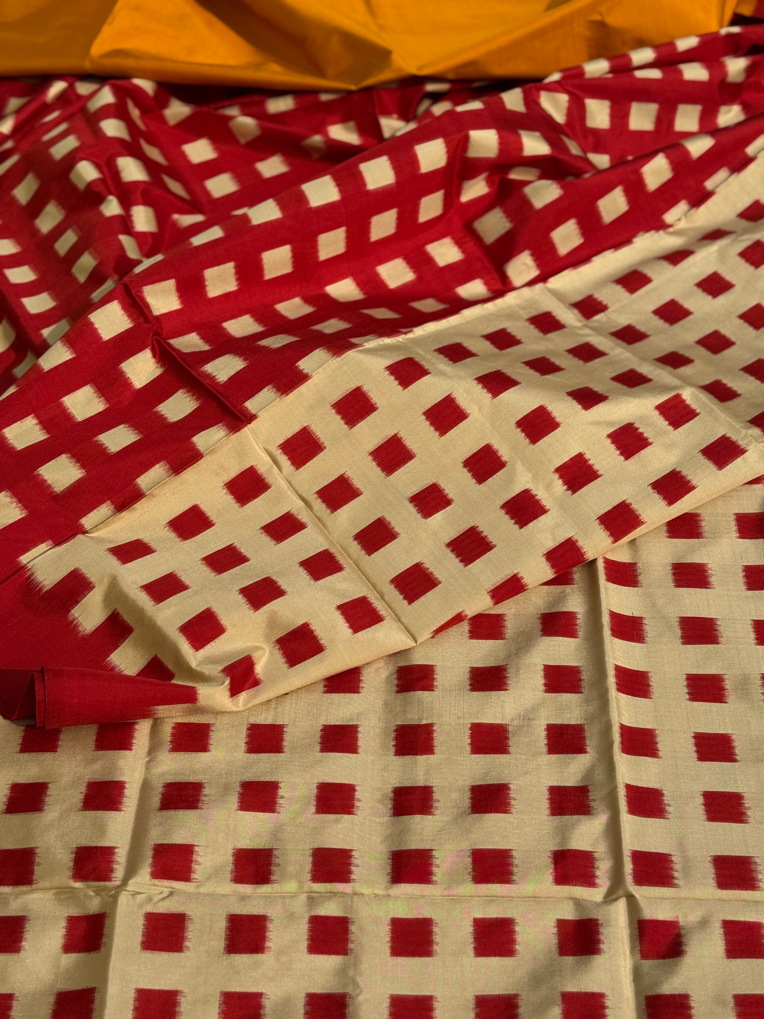 A contemporary take on solid block pattern double ikkat handwoven mulberry silk saree