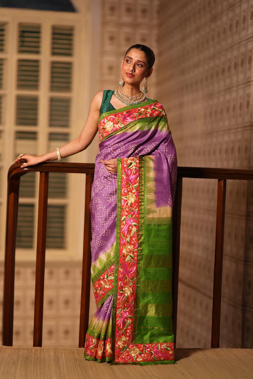 A stupendous kanchivaram silk saree in pastel lavender With hanknotted Bhandej and authentic Parsi Gara work handmade