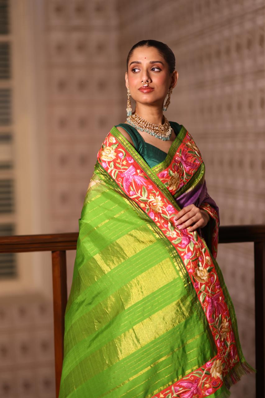 A stupendous kanchivaram silk saree in pastel lavender With hanknotted Bhandej and authentic Parsi Gara work handmade