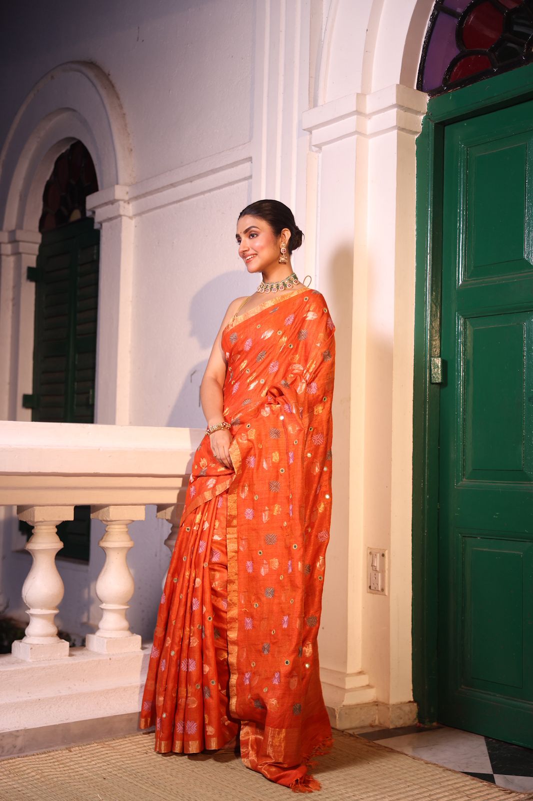 A rust orange matka tussar handwoven silk saree with hand embroidery phulkari work