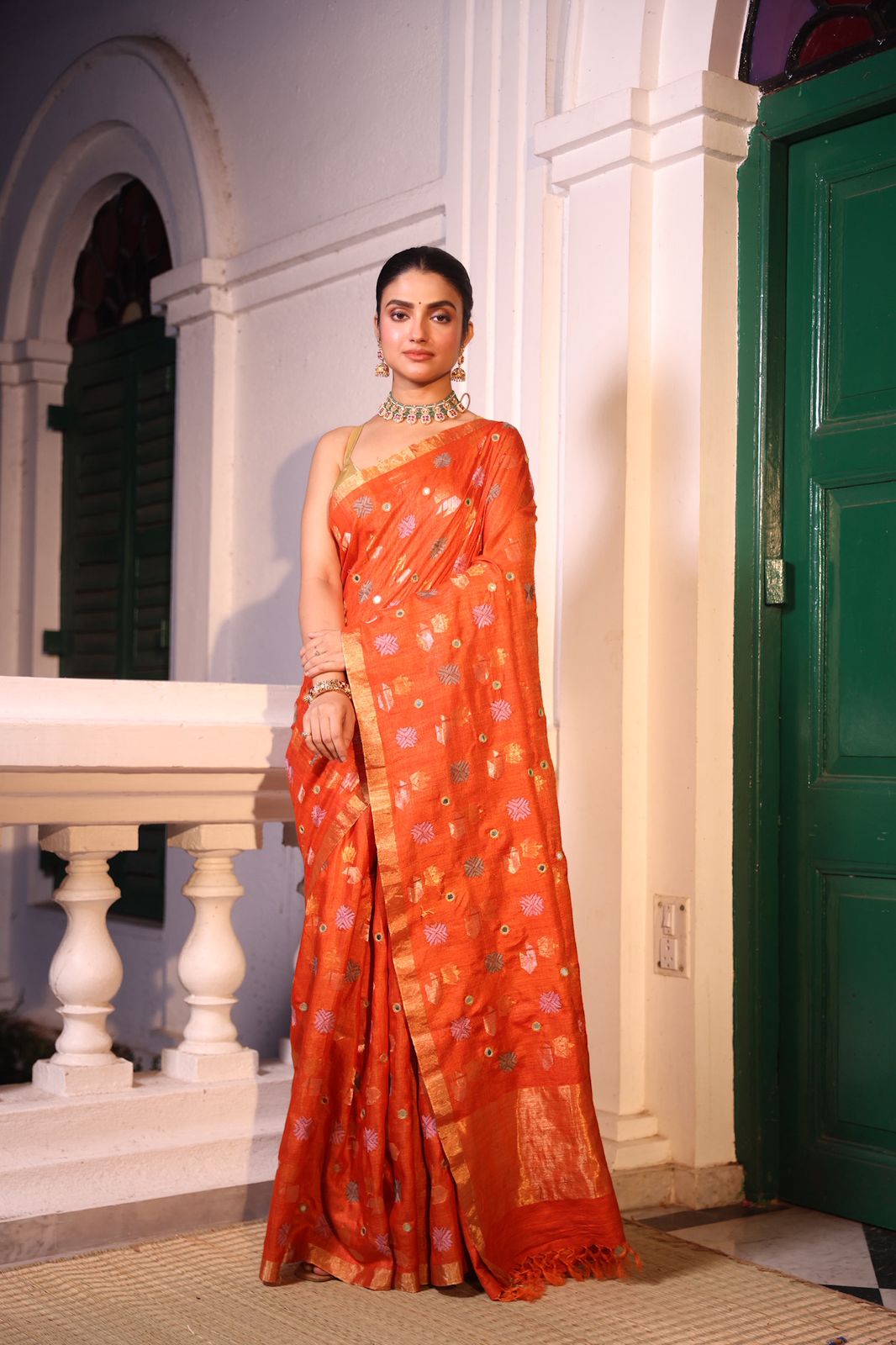 A rust orange matka tussar handwoven silk saree with hand embroidery phulkari work