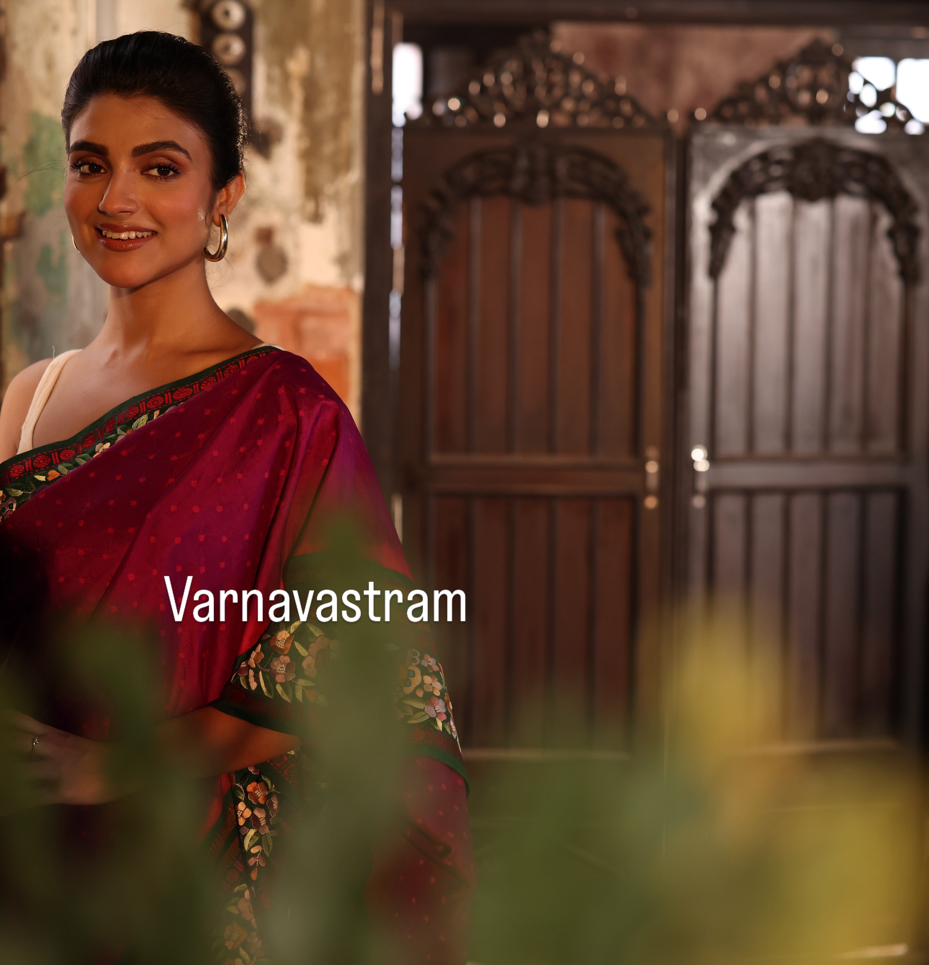 A plumpink kanchivaram weave silk saree with authentic Parsi gara work and handknotted rai Bhandej